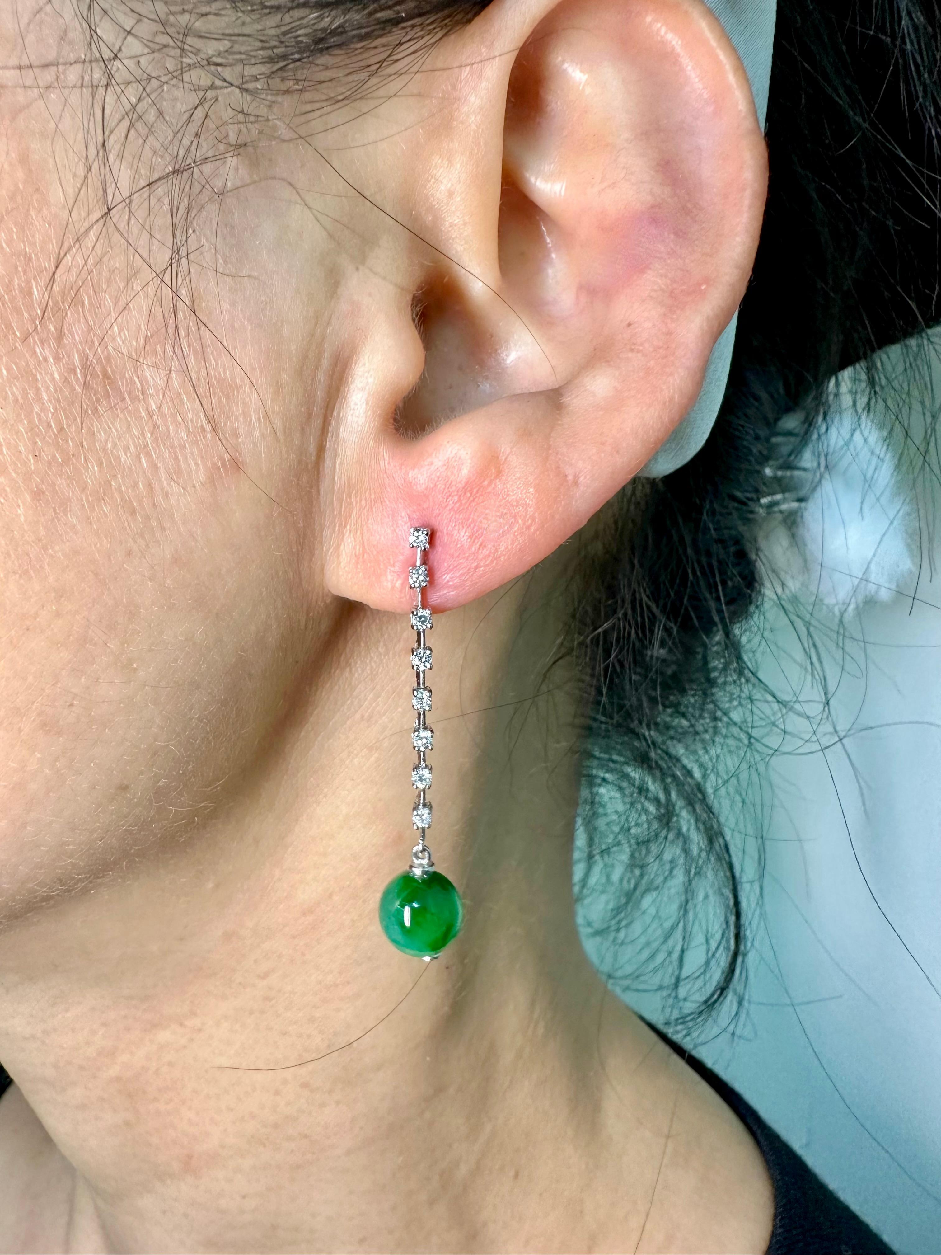 Please check out the HD video. This is a very special pair of drop earrings, the jade beads have a special glow to them that is mesmerizing. The apple and imperial green jade beads are certified to be natural without any treatments. The earrings are