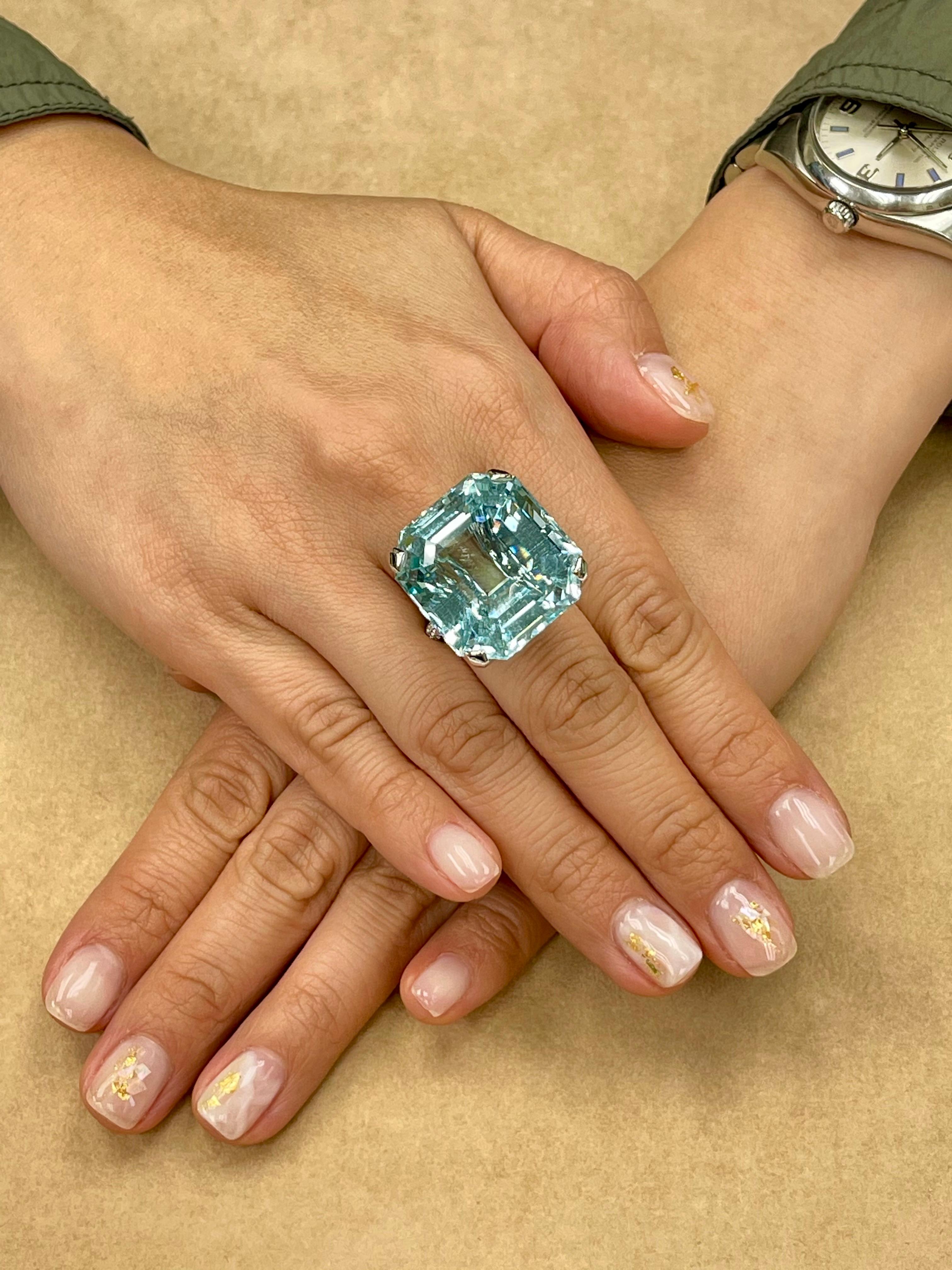 Check out the HD video! The video shows the most accurate color. This is a big statement piece! Here is a super nice Asscher cut Aquamarine and diamond ring. The center Aquamarine is a stunning 55.738 Cts. Not only is the size impressive, the