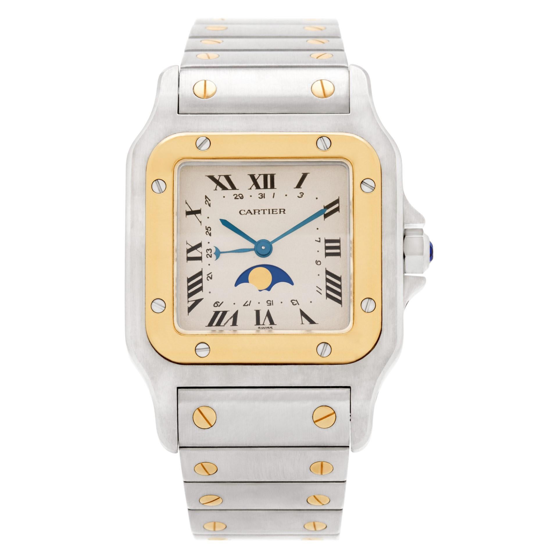 Cartier Santos de Cartier Reference #:119901. Stainless steel case and bracelet. Fixed, screwed 18K yellow gold bezel. Ivory / Cream dial with blue tone hands and Roman numeral hour markers. Date markers around the inner ring. Moon phase displays at