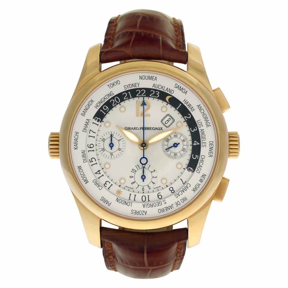 Girard Perragaux World Time Reference #:49805. Girard Perregaux World Time Chronograph in 18k on an original brown alligator strap with an original GP 18k gold tang buckle. Auto w/ subseconds, date, chronograph, dual time, world time and day night.