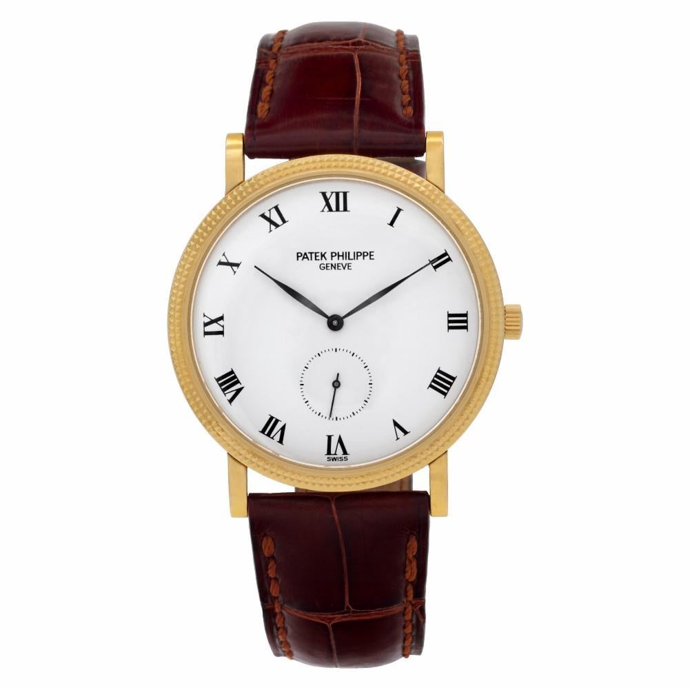 Patek Philippe Calatrava Reference #:3919. Unisex Patek Philippe Calatrava in 18k yellow gold on original alligator strap with 18k buckle. Manual w/ subseconds. With papers. Ref 3919. Circa 1992 Fine Pre-owned Patek Philippe Watch. Certified