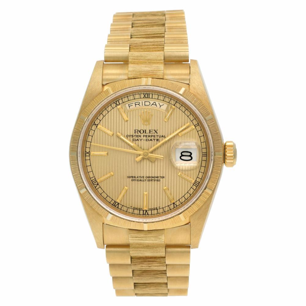 Rolex Day-Date Reference #:18078. Time capsule kept! Rolex Day-Date President in 18k with original bark finish band and bezel with gold tapestry dial. Auto w/ sweep seconds, date and day. With box, papers, and booklets. Ref 18078. Circa 1985. Client