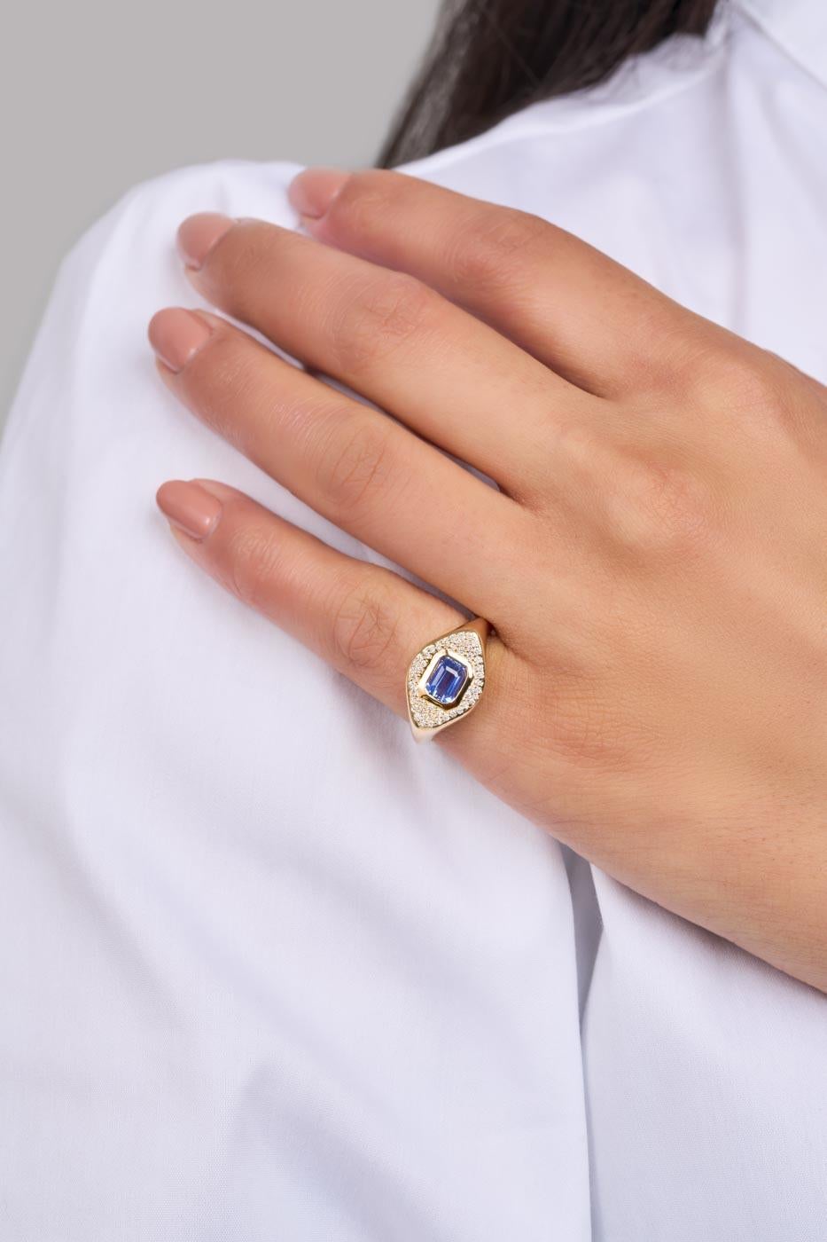 Blue Sapphire & Diamond Signet Ring displays a regal 1 carat natural blue sapphire at its centre, encased in sparkling white diamonds and set upon a solid 14-karat yellow gold base. 

Specifications: 
Gemstone: natural untreated, Ceylon Blue