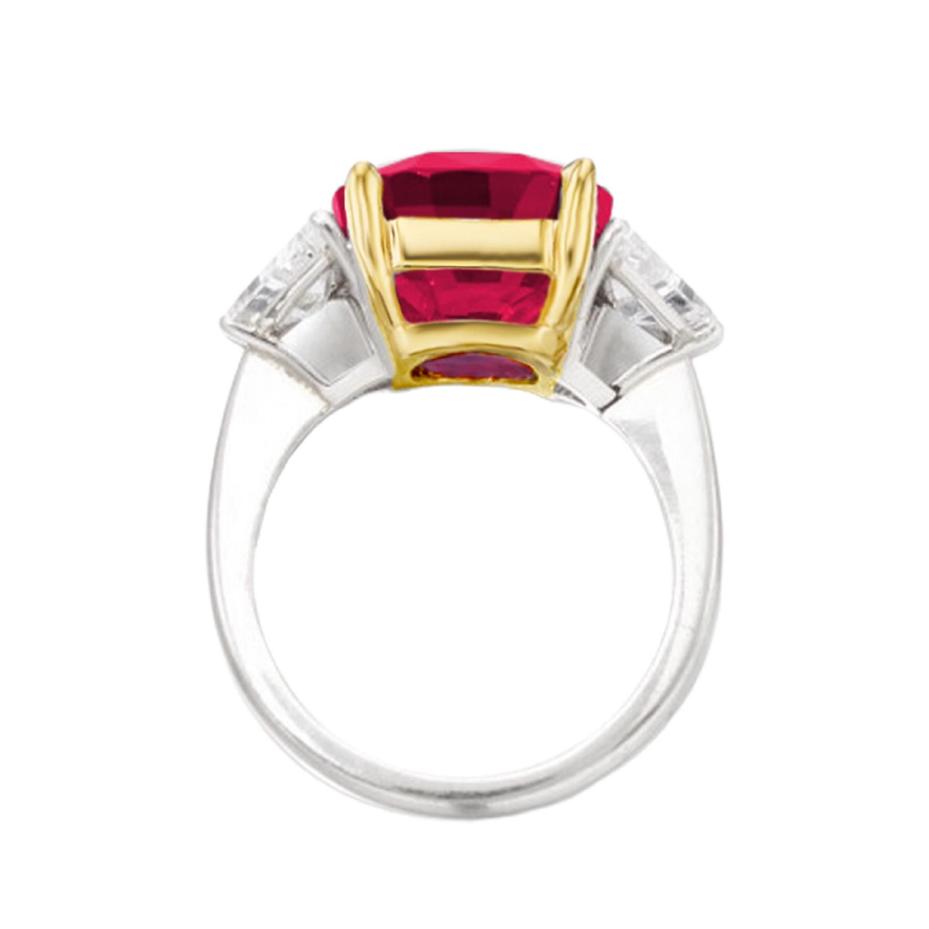 This exquisite ring features a substantial 5.01-carat cushion-cut ruby, renowned for its captivating 