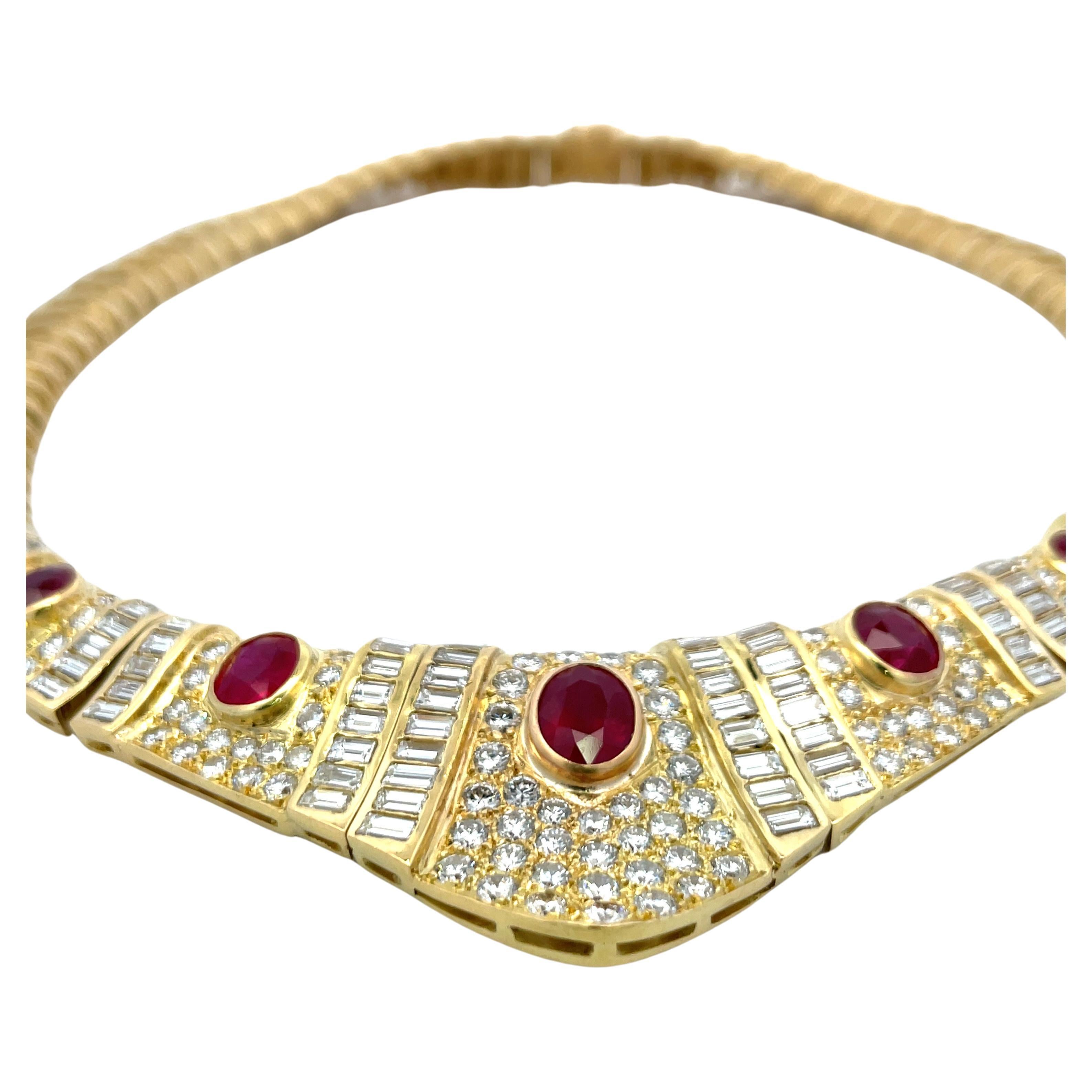 Vintage 18 Karat yellow gold collar necklace featuring 5 Oval Burma Rubies weighing 7.50 Carats, Heated, flanked with baguette and round brilliants weighing approximately 17 carats.

