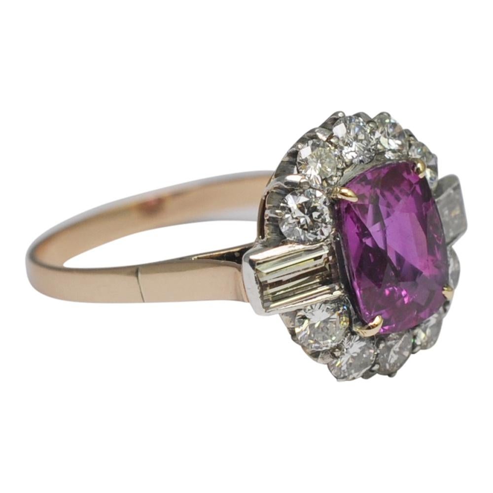 Beautiful pink sapphire and diamond cluster vintage engagement ring;  the vivid, rich deep pink sapphire weighs 2ct and is accompanied by a certificate stating it to be a natural sapphire of Burmese origin with no evidence of heat treatment.   The