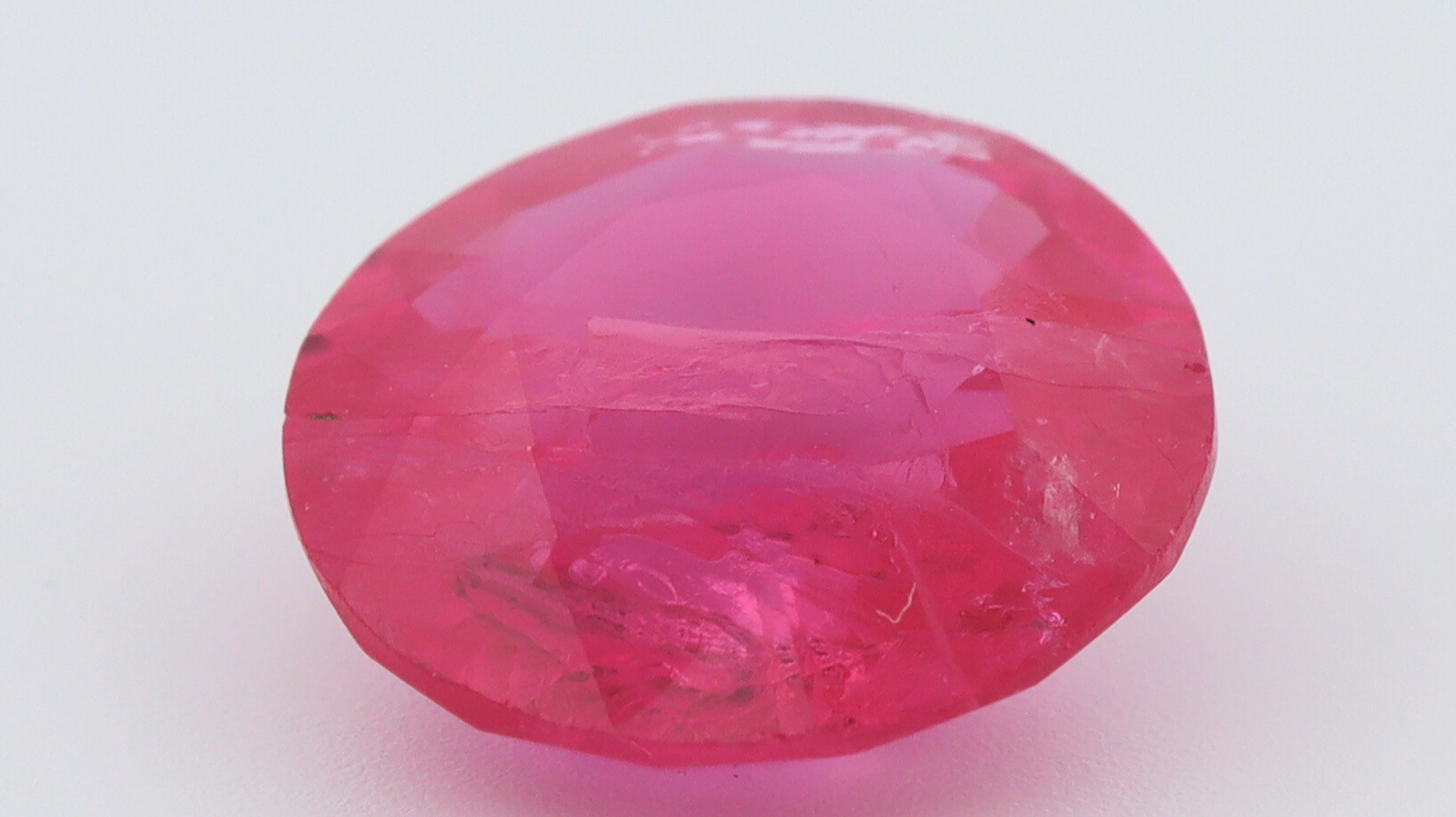 Rubies are the Red variety of the Mineral Corundum, composed of aluminum and oxygen (Al2O3), and the presence of Chromium is what gives this stone the so much desired Red Color. 
Its presence can also cause natural fluorescence, which further