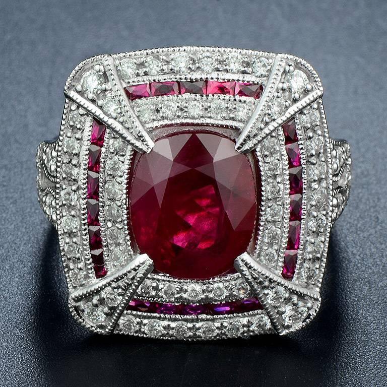Heated Ruby origin from Myanmar weight 3.90 Carat set with French Cut Ruby 22 pieces 1.4 Carat and Brilliant Cut Diamond 70 pieces 0.62 Carat on 18K White Gold Ring

This Ring was made in size US#7
