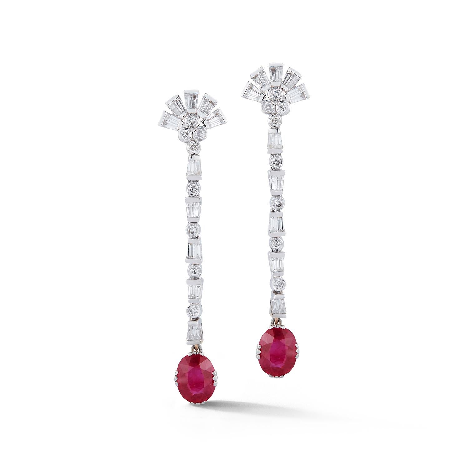 Certified Burmese Ruby & Diamond Dangle Earrings
2 oval cut rubies approximately 3.93 cts certified by AGL laboratory as Burmese origin
16 round cut diamonds & 40 baguettes approximately 1.80 cts
18k white gold.
Back Type: Clip On with post