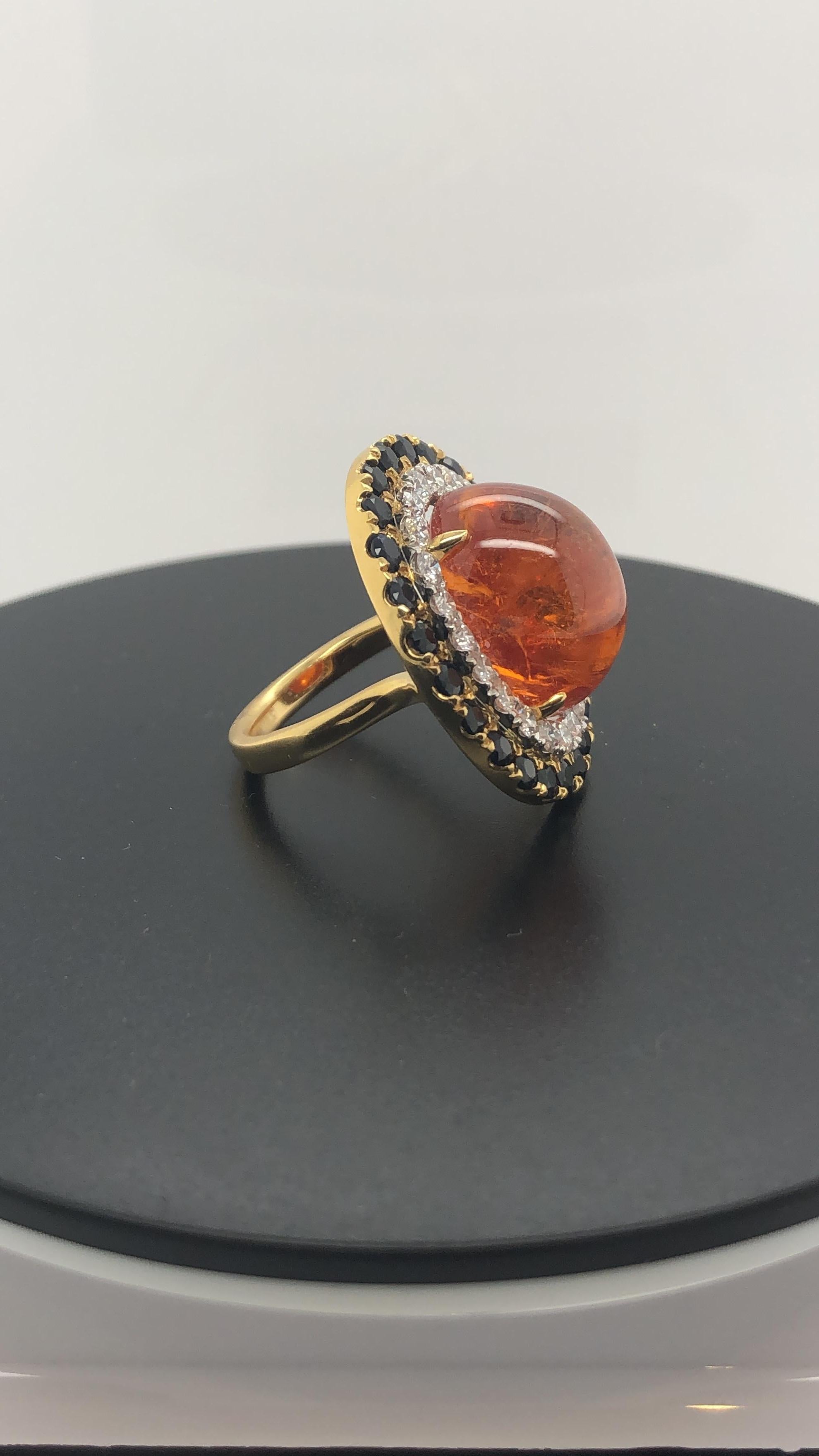 18 carat yellow and white gold Handmade Cocktail Ring, set with a certified Natural 27.66 carat Cabochon Spessartite Garnet, 