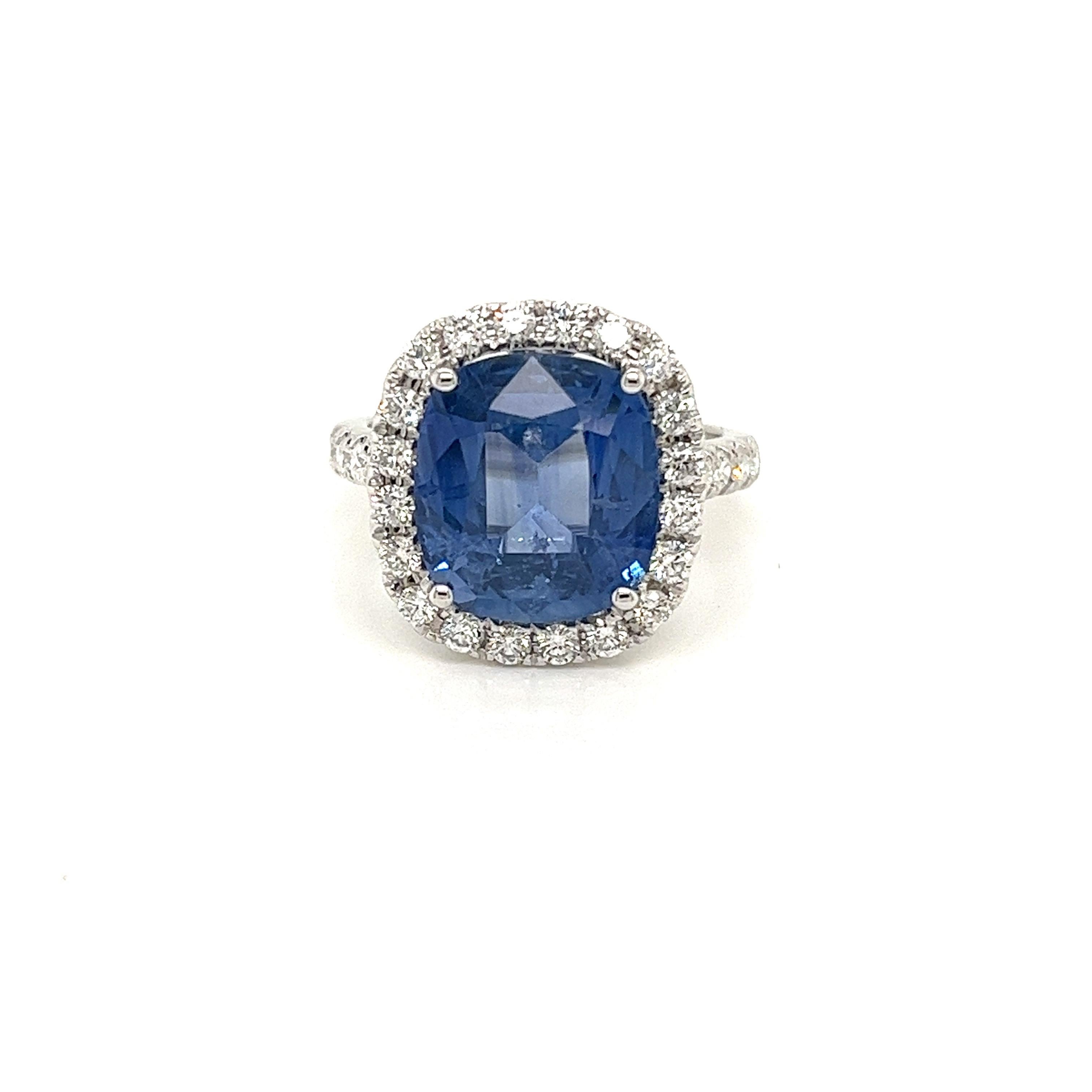 Certified Cushion Ceylon Sapphire weighing 5.89 carats
Measuring (11.67x10.61x5.61) mm
Diamonds weighing .77 carats
GH-SI1
Set in 18k white gold ring
4.56 g