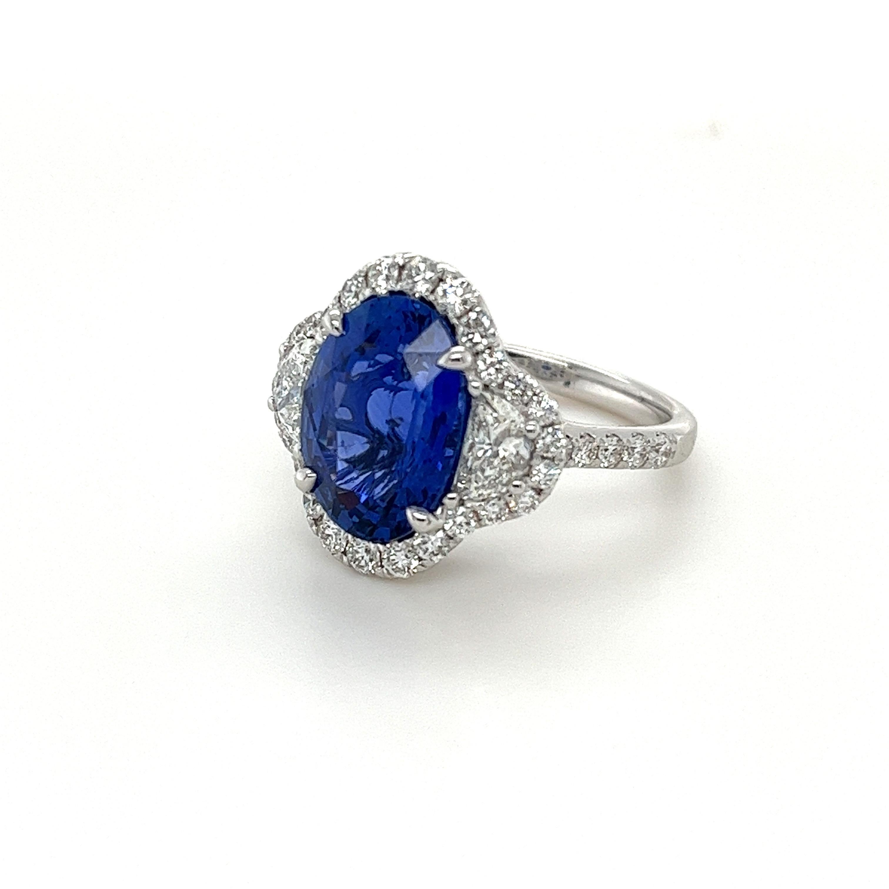 Certified oval Ceylon Sapphire weighing 5.67 carats
Measuring (12.62x9.26x5.95) mm
Half Moon Diamonds weighing .65 carats
36 round diamonds weighing .78 carats
H VS2-SI1
Set in 18k white gold ring
5.99 g