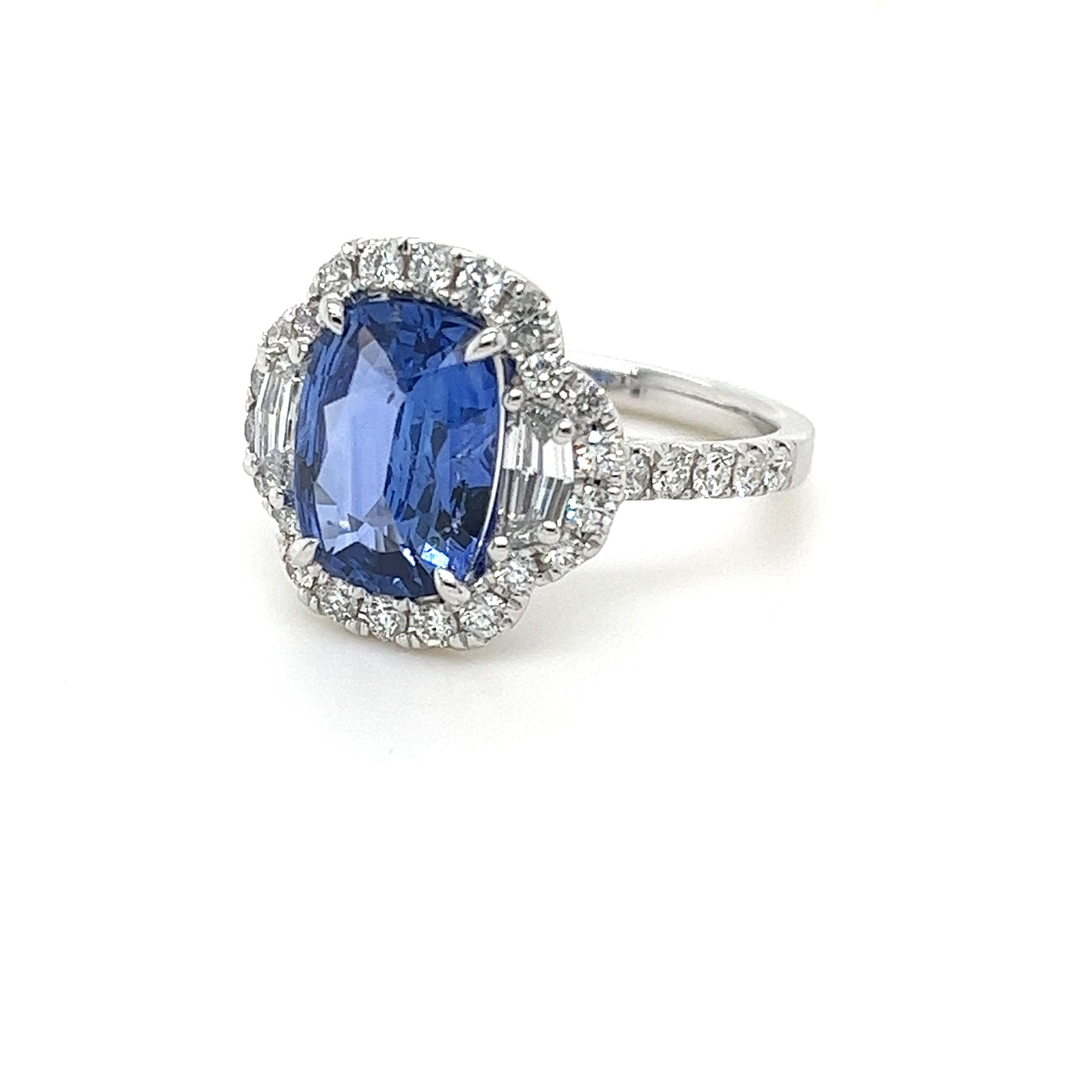CDC certified cushion Ceylon Sapphire weighing 3.08 carats
Measuring (10.78x8.11x3.96) mm
32 round diamonds weighing .66 carats
2 Cadillac diamonds weighing .41 carats
E-VVS
Set in 18k white gold ring
5.01 g