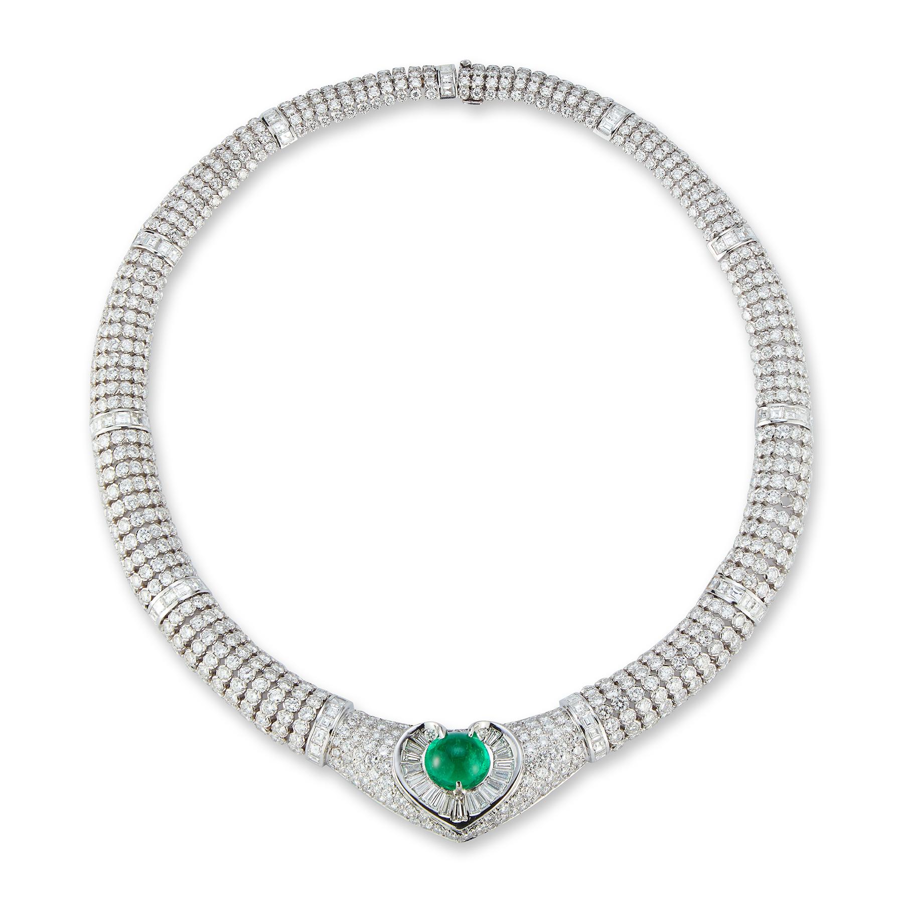 Certified Colombian Cabochon Emerald & Diamond Heart Shape Necklace 

1 cabochon emerald set in the center surrounded by baguette & round cut diamonds
840 round cut diamonds and 87 baguette cut diamonds weigh approximately 60 carats
Measurements: