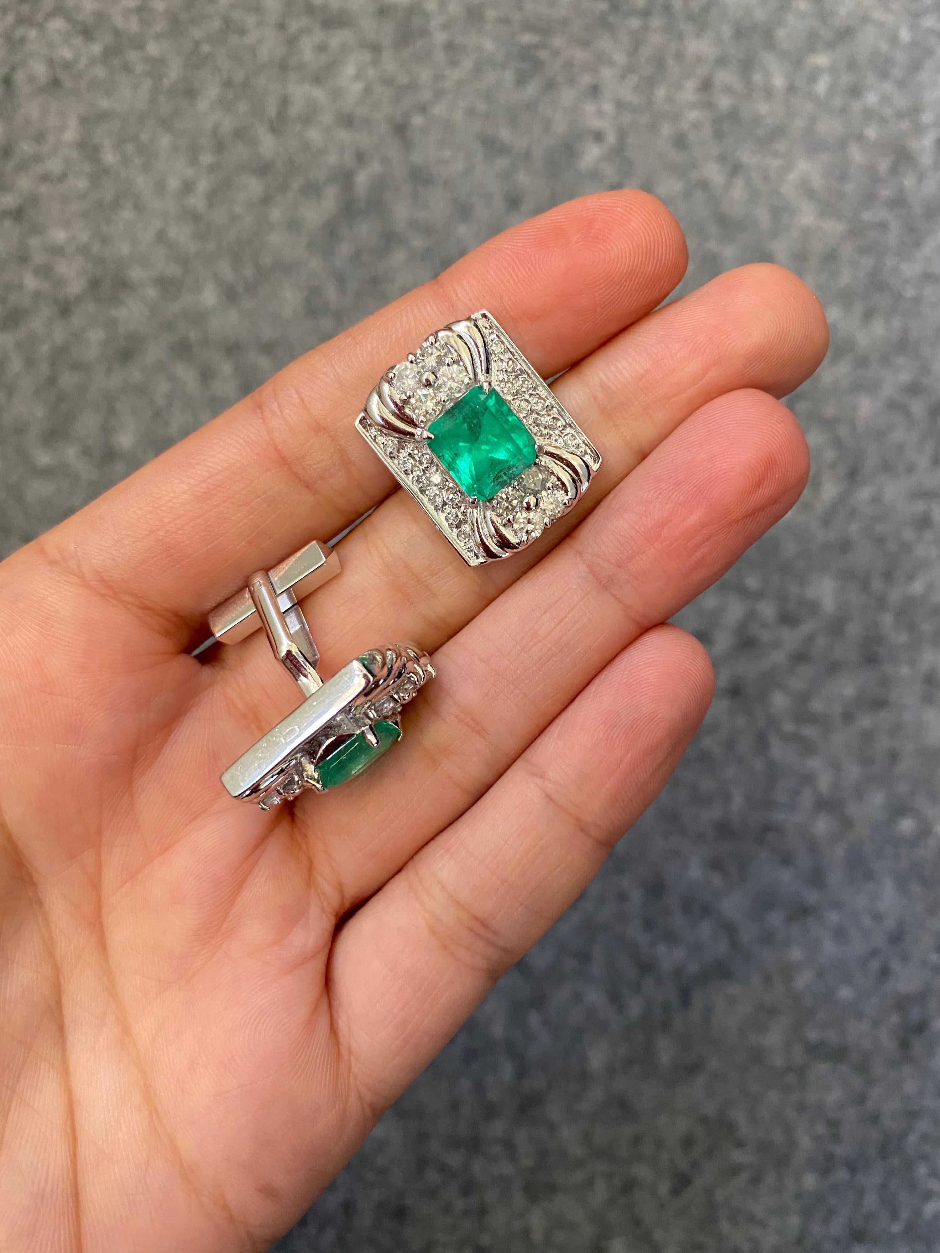 An art-deco inspired set of beautiful Colombian Emerald and Diamond cufflinks and tie-tack, set in Platinum. The cufflinks consist of 4.93 carats transparent, full of luster Colombian Emeralds and 2.08 carats of colorless, VS Diamonds. The tie-pin