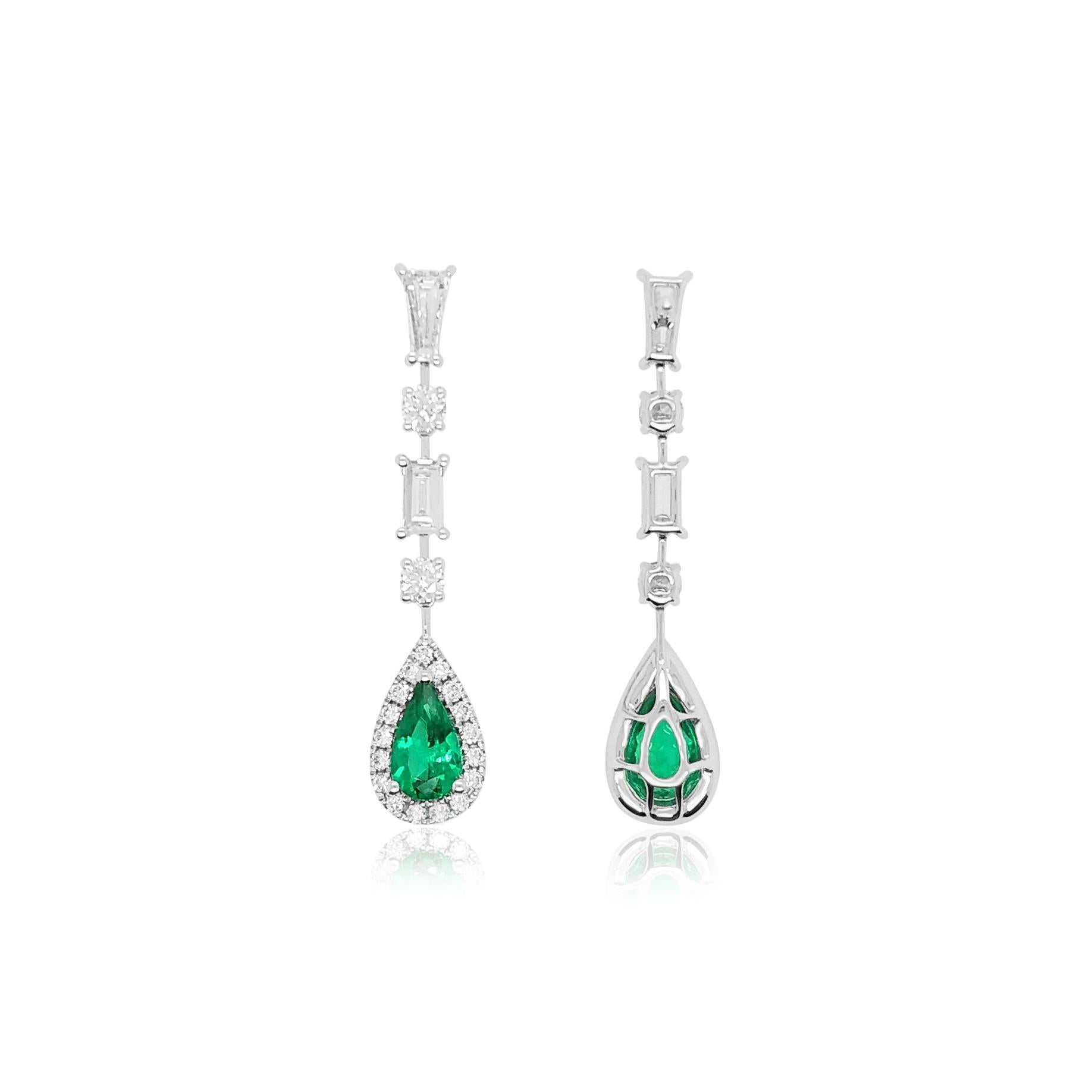 These elegant 18K White Gold earrings feature natural Colombian Emeralds beneath a delicate diamonds stream. Set in 18 Karat white gold to perfectly enrich the colour of the emerald and the sparkle of the diamonds, these intricate earrings will add