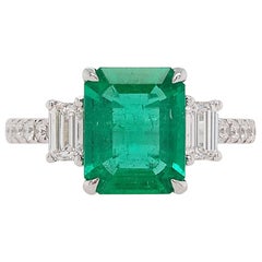 Certified Colombian Emerald and White Diamond in Platinum Three-Stone Ring