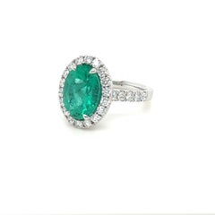Certified Colombian Emerald & Diamond Halo Ring in 18 Karat White Gold