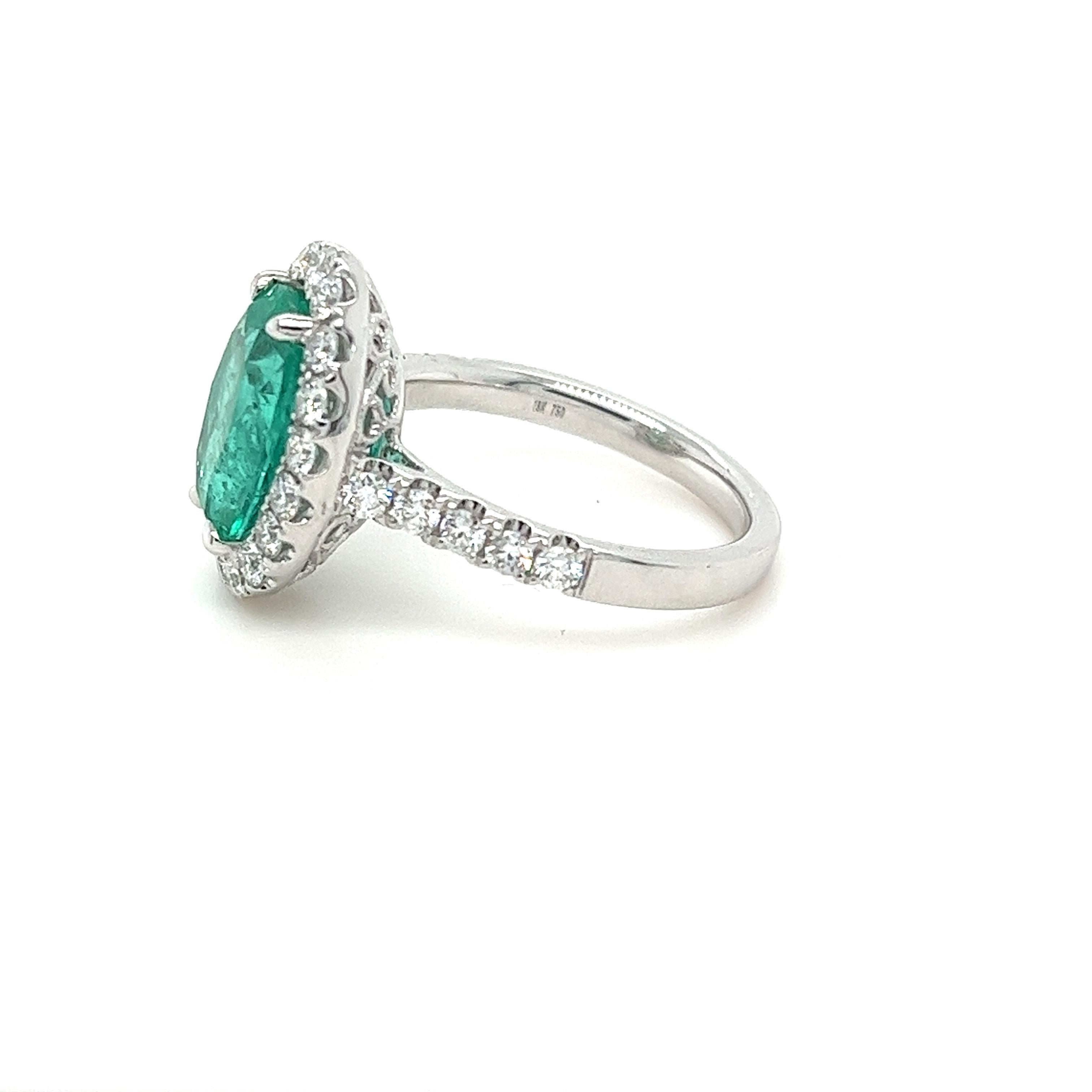 Modern Certified Colombian Emerald & Diamond Halo Ring in 18 Karat White Gold For Sale