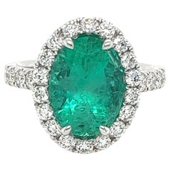Certified Colombian Emerald & Diamond Halo Ring in 18 Karat White Gold
