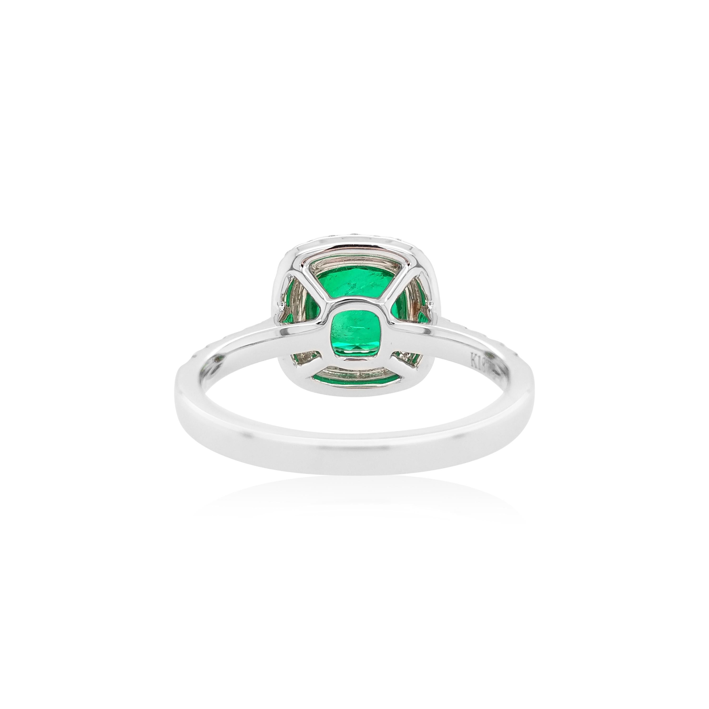 This stunning ring features a lustrous Cushion-shape Colombian Emerald at the centre surrounded by a bold pattern halo of Yellow diamonds and White diamonds which enables the light to sparkle in a unique way. Set in luxurious 18K white gold and