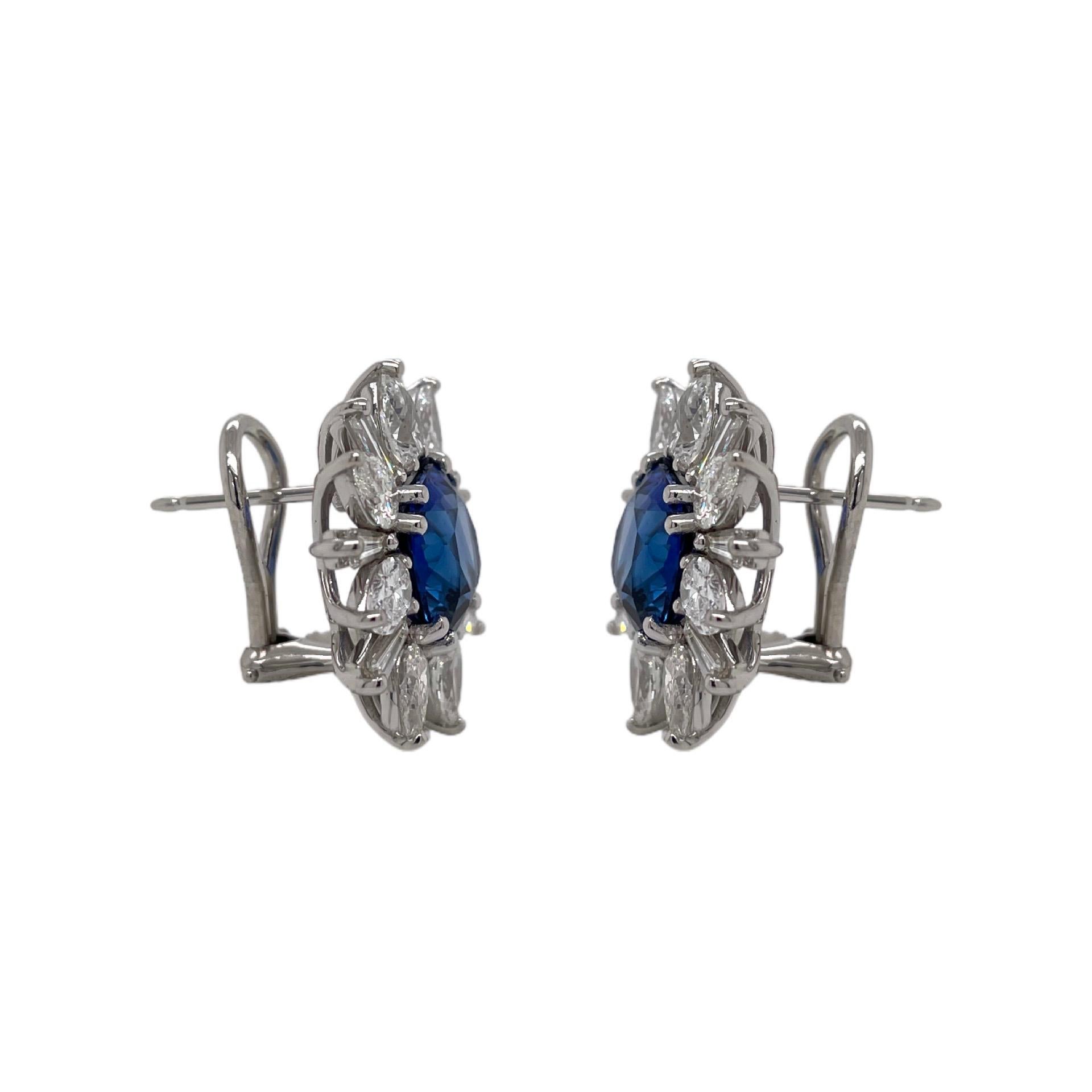 Earrings contain 2 finely matched sapphires 7.10tcw, 16 pear shape diamonds 4.16tcw and 16 baguette diamonds, 1.35tcw. Diamonds are colorless and VS2 in clarity, excellent cut. All stones are mounted in a handmade 18K prong setting with a French