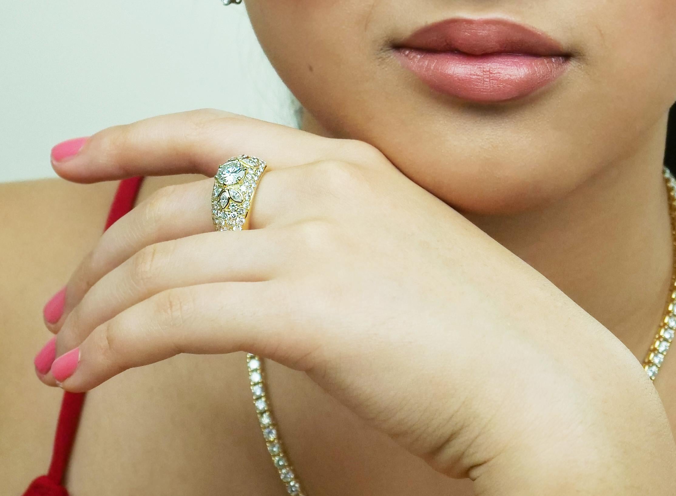This ring is divine, it is a magnificent creation of a thick chunky yellow gold band, the purest shade of yellow, stunning clarity and gentlest of your skin that’s been encrusted with more diamonds than you could picture. These diamonds glisten with