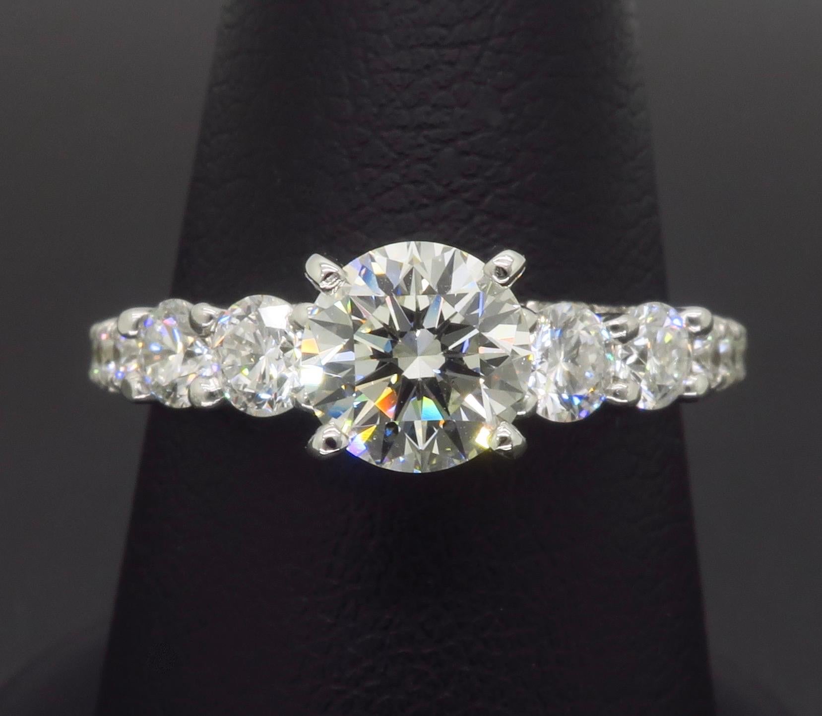 Certified Diamond engagement ring featuring a beautiful diamond encrusted gallery. 

Center Diamond Carat Weight: .86CT
Diamond Cut: Round Brilliant Cut
Center Diamond Color: I
Center Diamond Clarity: VS1
Certification: IGI - 33253891 - Diamond is