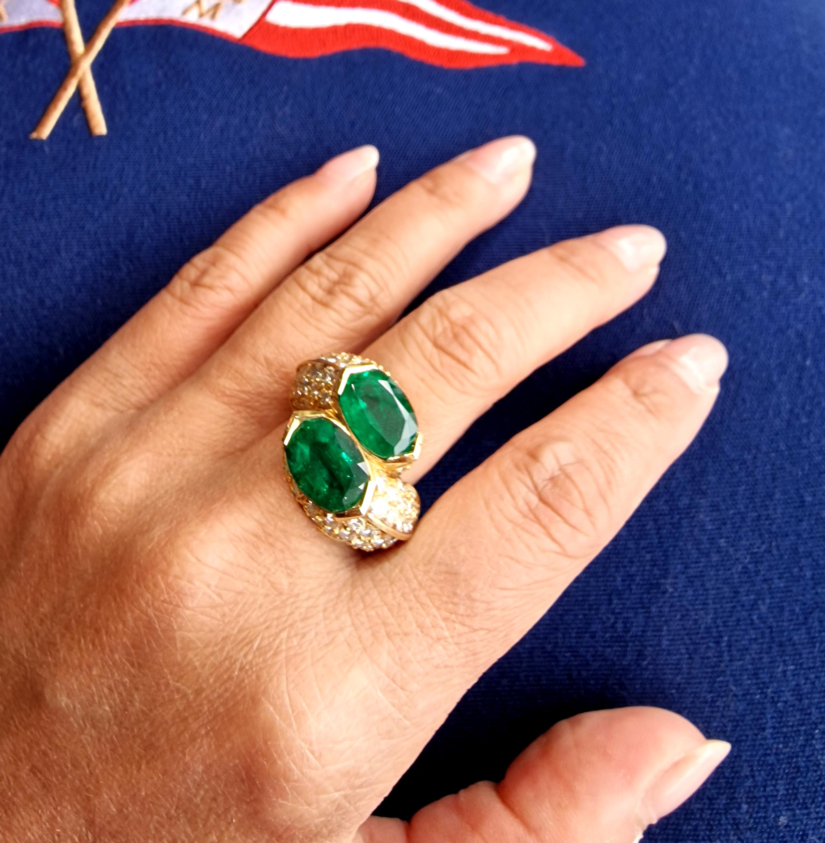 Twin perfectly matched fine oval cut Zambian emeralds of intense green with minor clarity enhancement, each weighing 2.7cts (total weight 5.4cts) held in 18ct yellow gold with brilliant cut accent diamonds set into the shoulders and bezel.
Capture