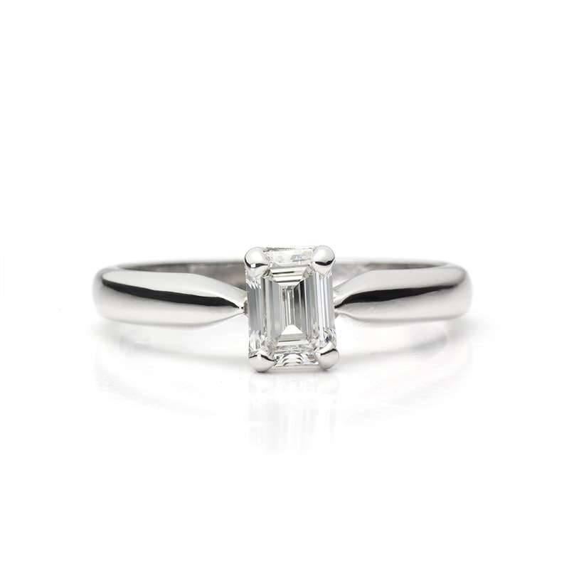 18k White Gold Single Stone Ring Claw set with an Emerald Cut Diamond of 0.73ct, Colour G, Clarity VS2. US size 7, EU size 55 and UK size O. Gross Weight 3.9g.

IGI Diamond Report F4A45749

With Box and Our Own Certificate of Authenticity.  