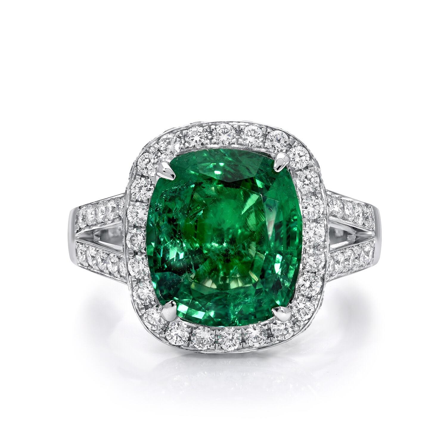 Emerald engagement ring featuring a 4.66 carat vibrant Emerald cushion cut, accented by a total of 1.06 carats of round brilliant diamonds, in 18K white gold.
Emerald ring size 6.5. Resizing is complimentary upon request.

The C. Dunaigre gem
