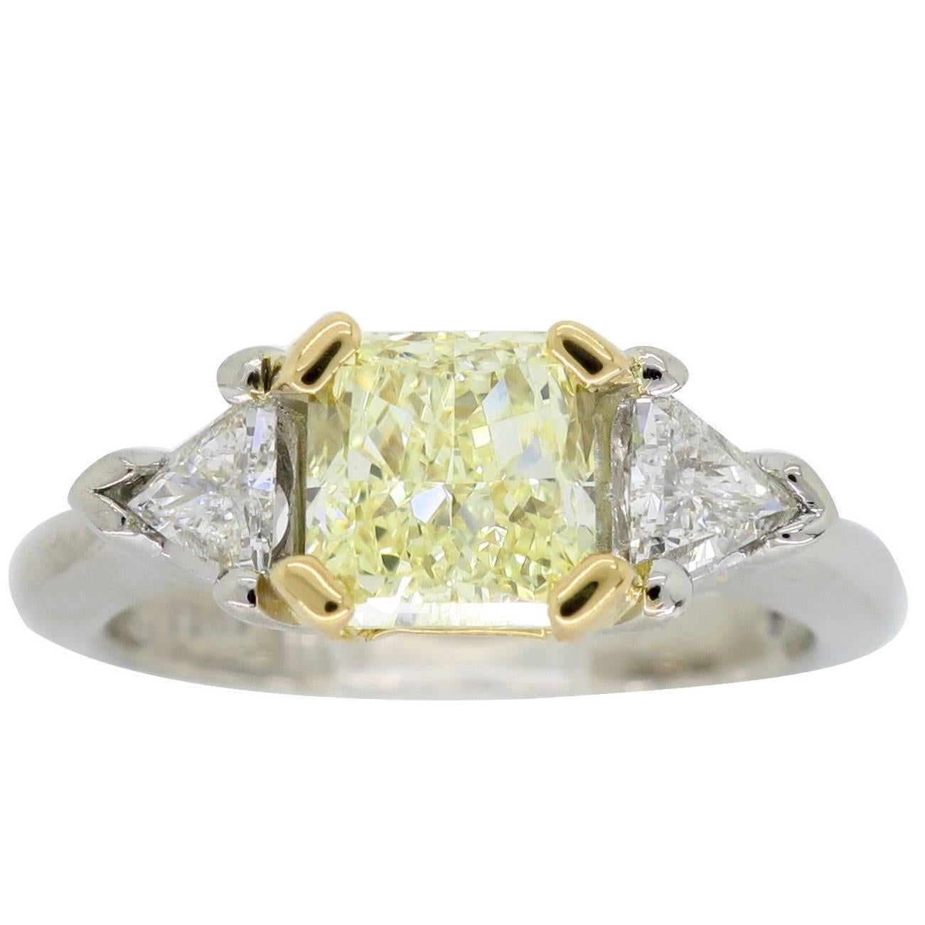 Certified Fancy Yellow Three-Stone Diamond Ring in Platinum and 18 Karat Gold