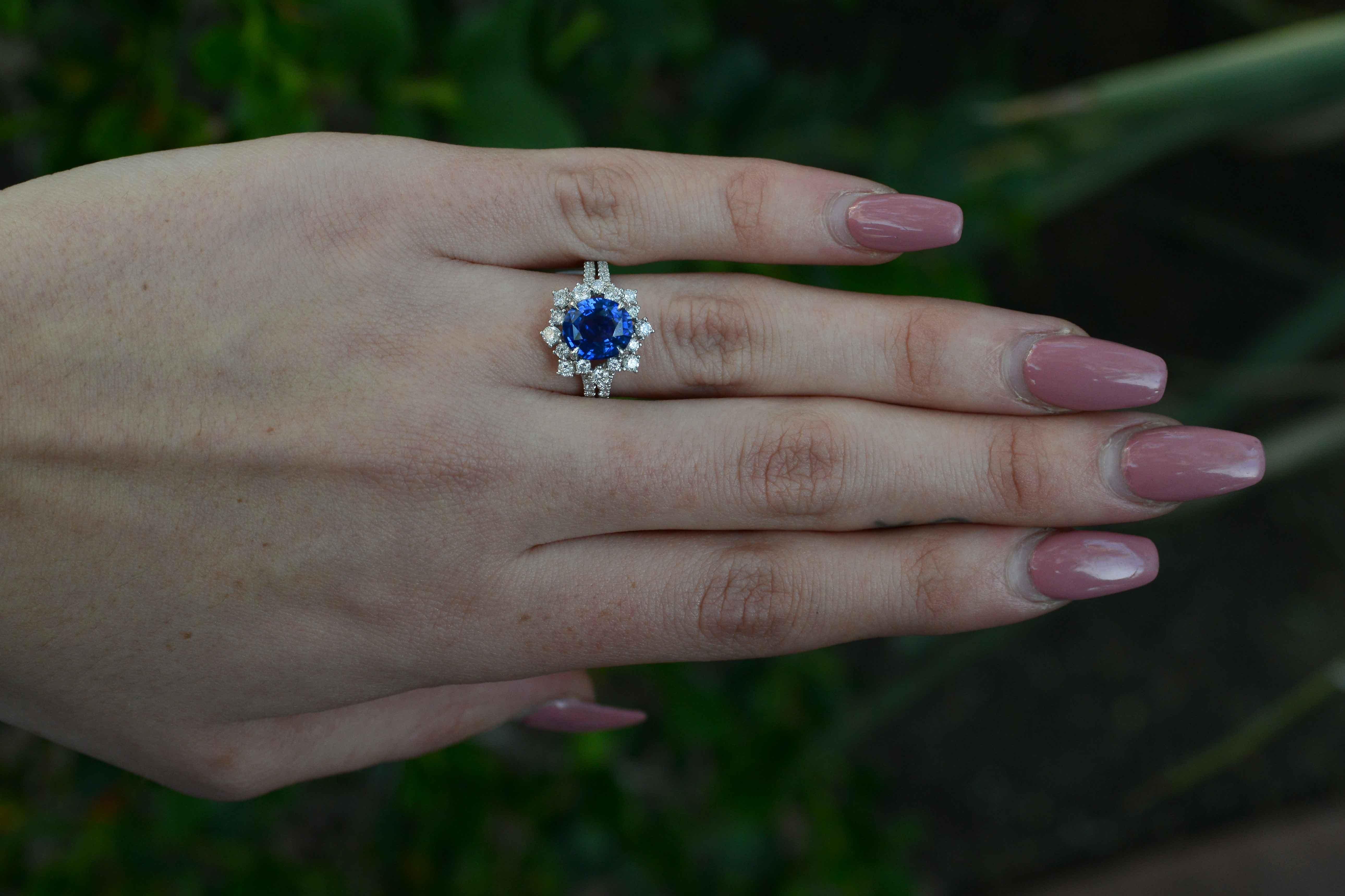 The electric blue of this certified, fine 2.77 carat gemstone is exceptional. Surrounded with a fiery 1 carat diamond halo, this vintage heirloom has us abuzz with excitement. The incredible luster and vivid color is mesmerizing. The composition