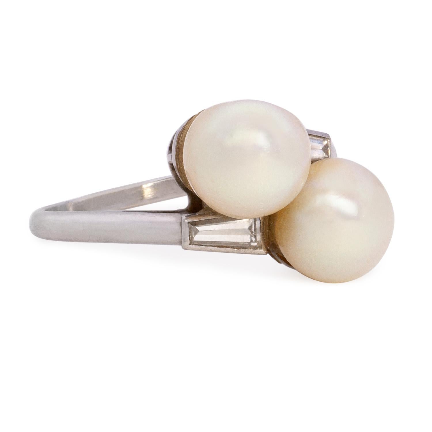 Introducing our exquisite Elegant Toi et Moi Ring, a sophisticated blend of timeless elegance and modern allure. Crafted in platinum, this ring features two stunning fine white pearls and two calibrated baguette diamonds, all delicately set in a