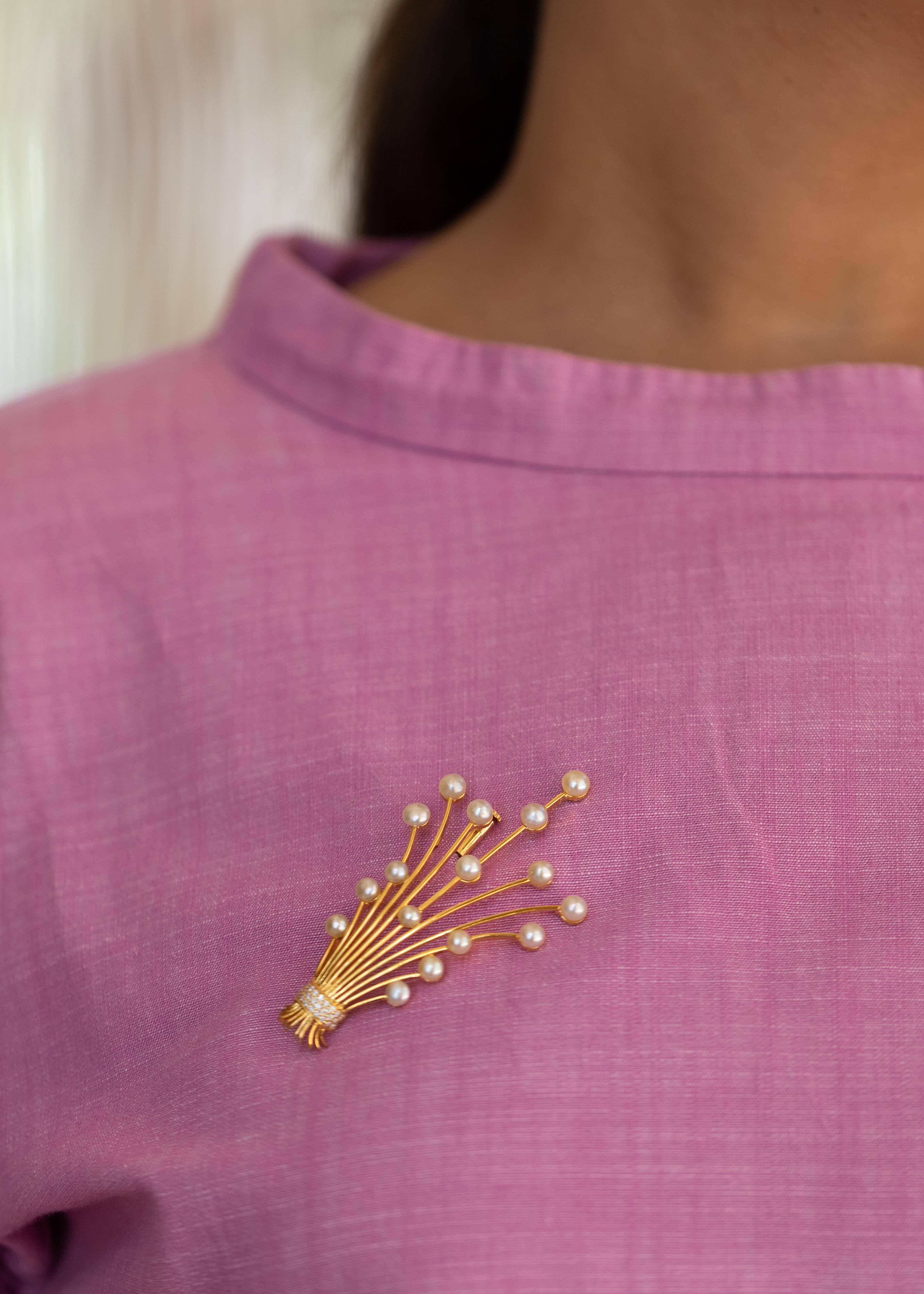 Yellow gold stems, natural Bahraini pearl flowers and a diamonds string...
This bouquet is a showstopper, it is a wearable piece of art.
The brooch is designed and handcrafted in Bahrain.

The pearls are certified from the top rated pearl testing