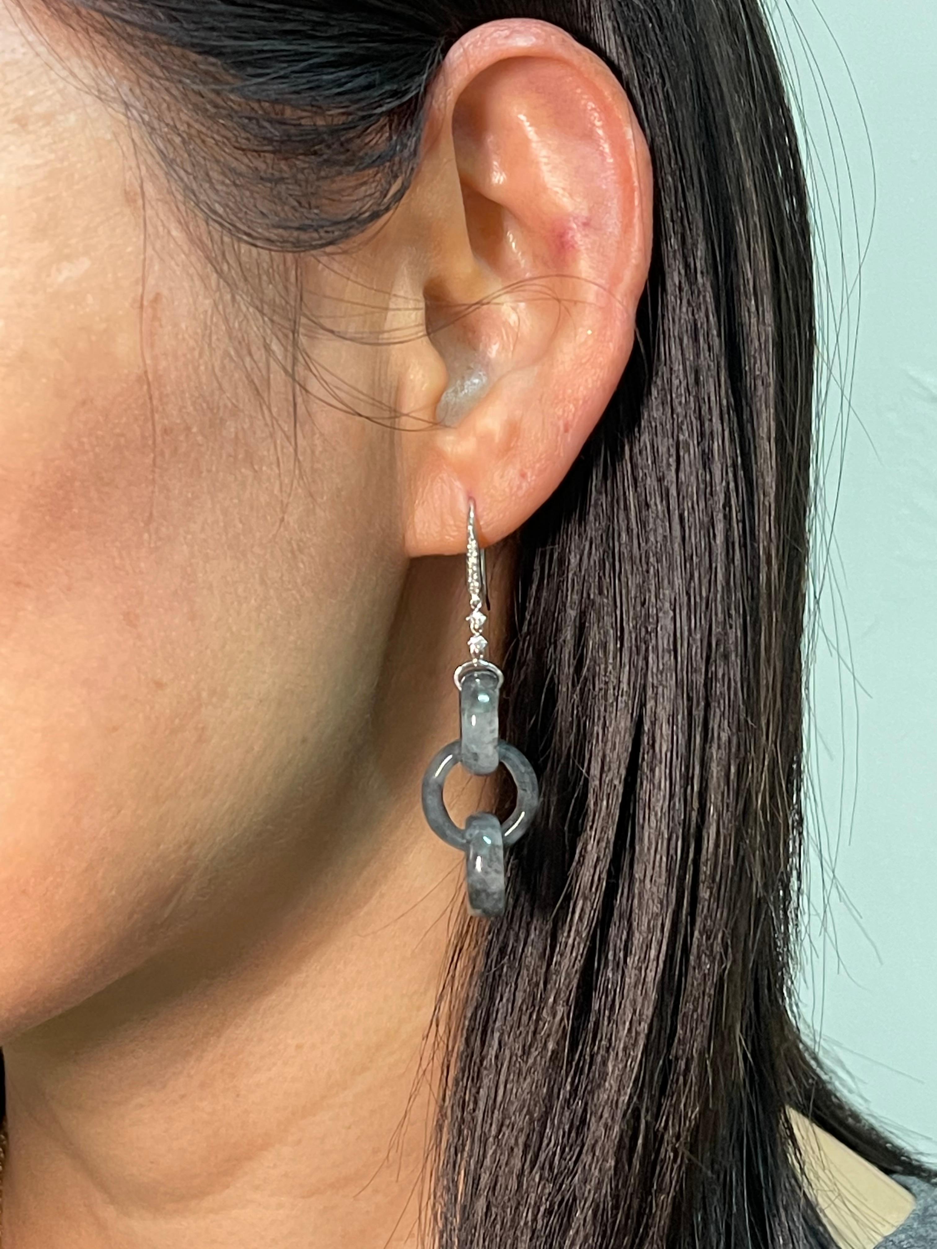 Please check out the HD video! The perfect icy black jade. Here is a pair of natural Icy black Jadeite Jade earrings that are extremely difficult to make. Three solid interlocking links carved out of one block of jadeite material. Icy black jade of