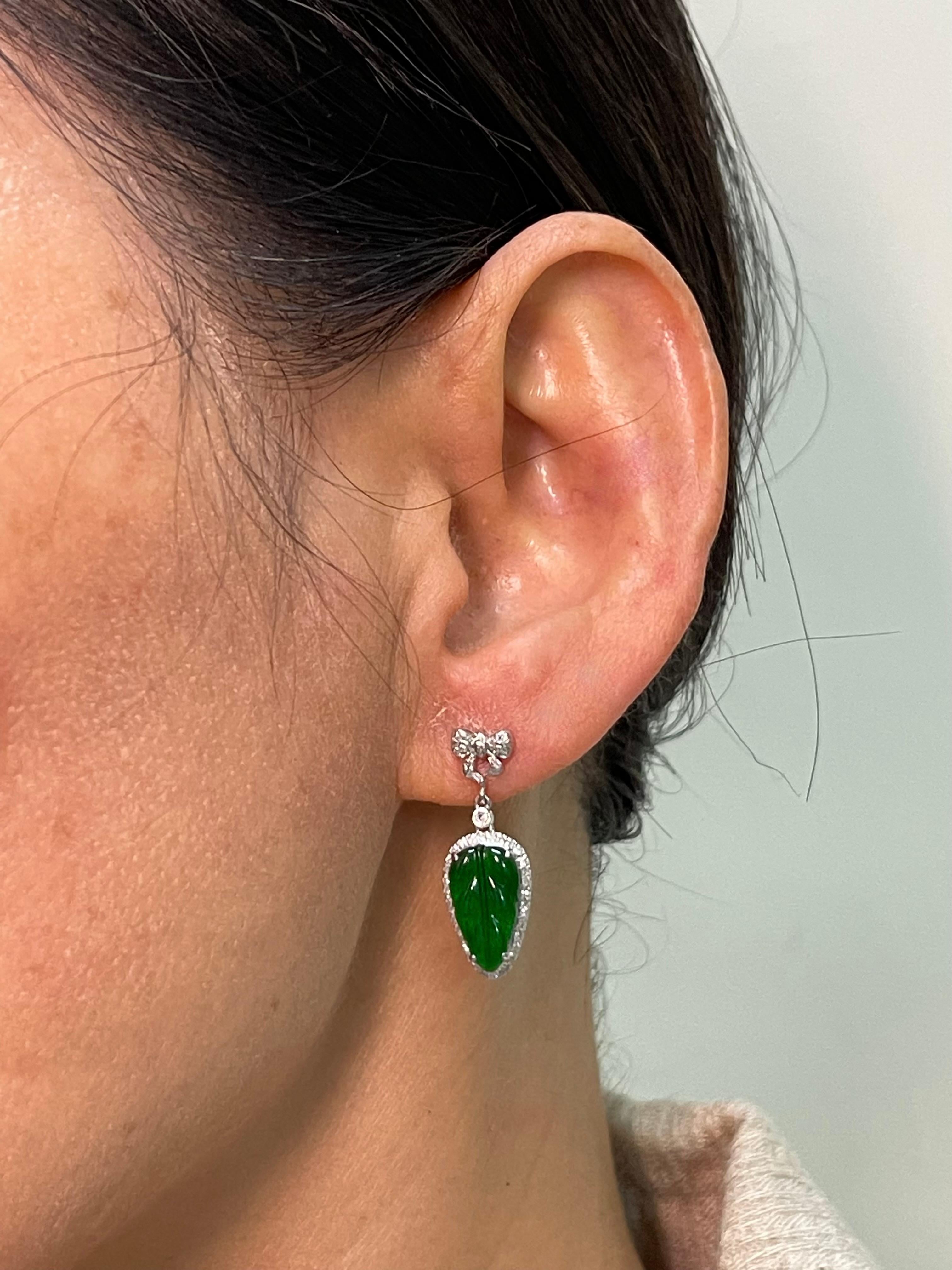 This is a very special pair of earrings. Made with the best imperial jade. They GLOW! The jade in these earrings are certified by 2 labs to be natural jadeite jade. The earrings are set in 18k white gold with posts backs. There are 2 carved imperial