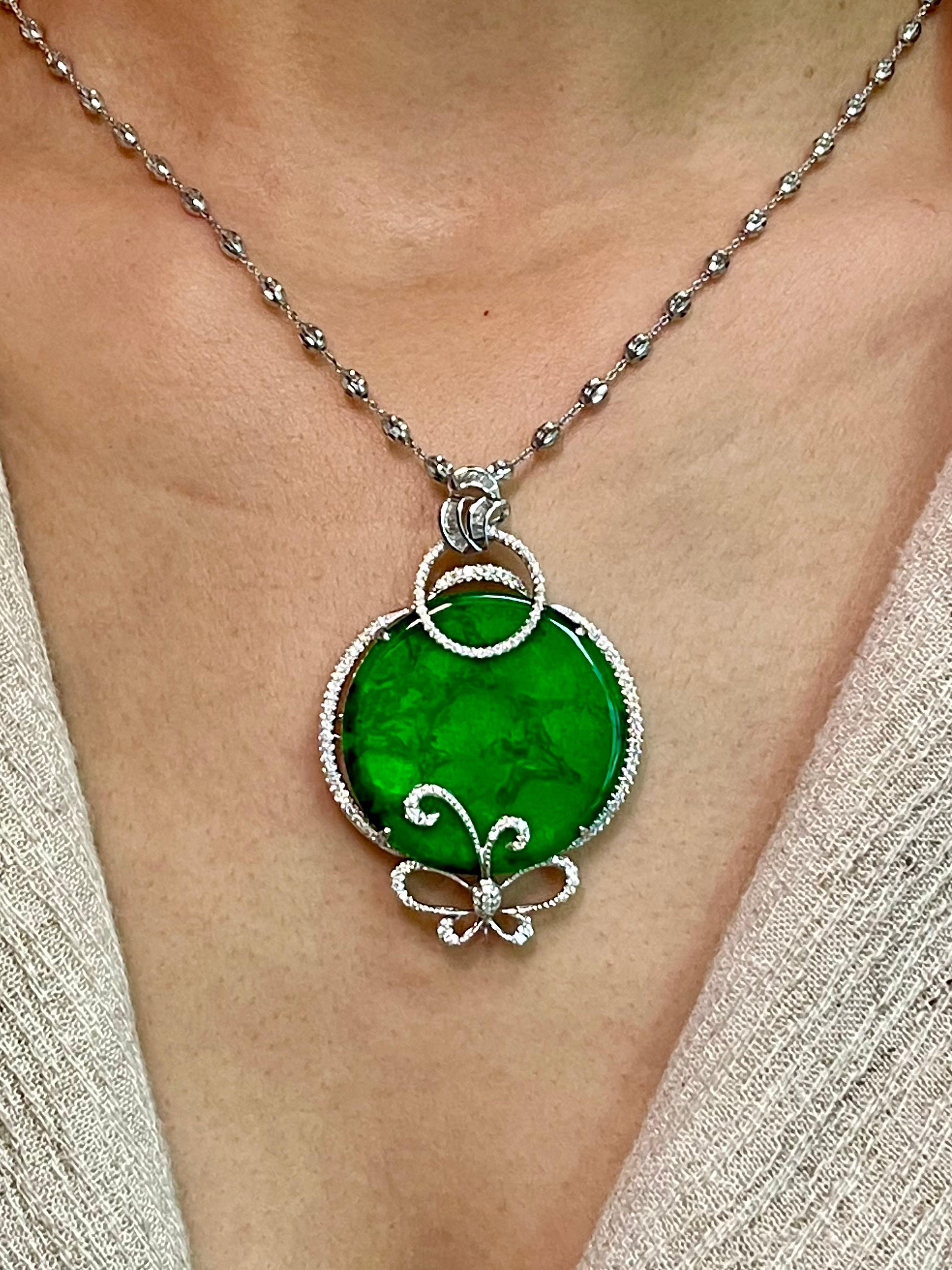 Please check out the HD video! This is a collector's item! This certified natural jadeite jade has no treatment and un-enhanced. The pendant is set in 18k white gold and diamonds with a diamond butterfly motif. There are 0.71 cts of white diamonds