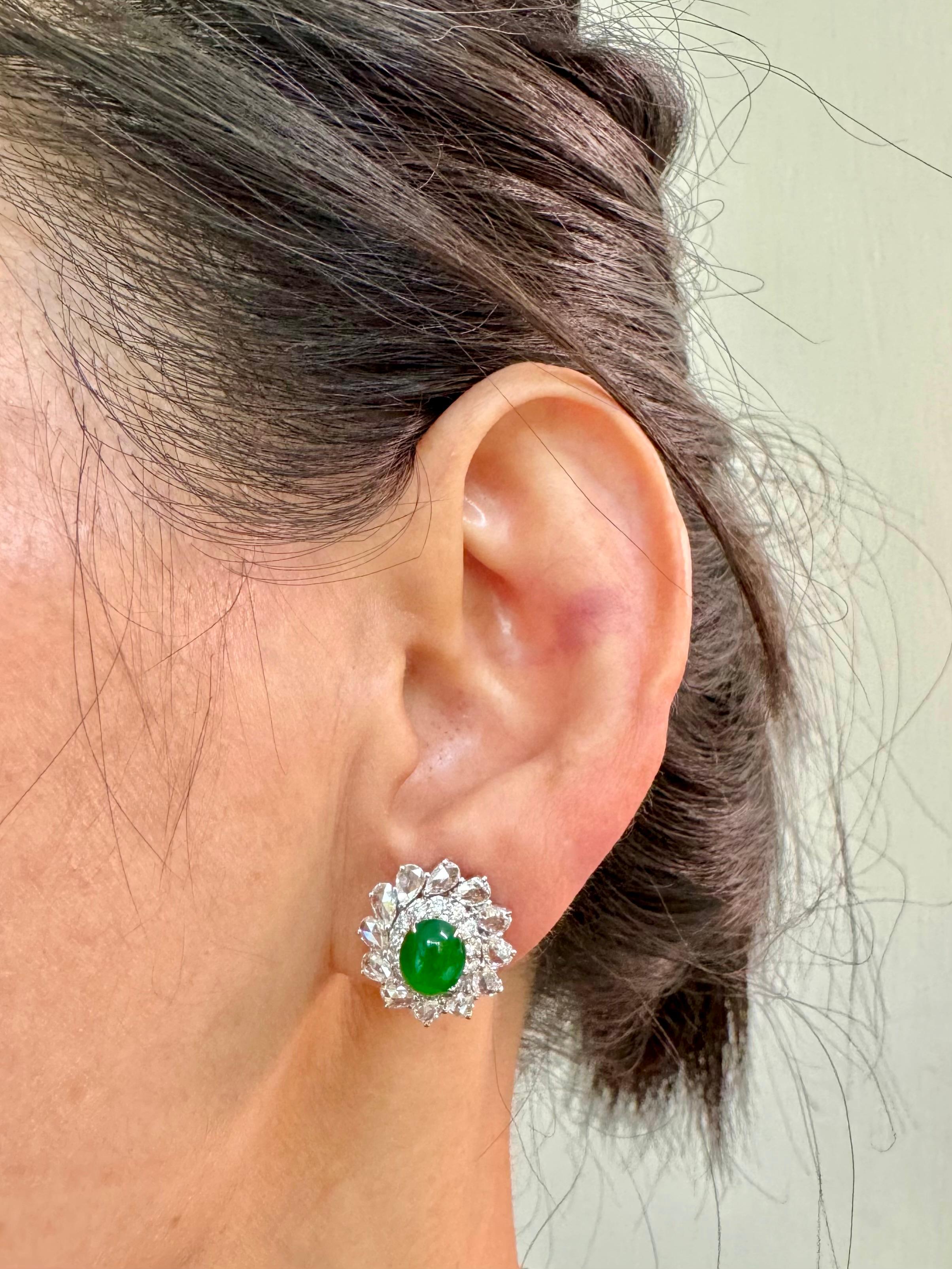 Please check out the HD video! It doesn't get much better than this! Here is a nice pair of true imperial green Jadeite Jade earrings. It has the best of the best glowing green color. The earrings are about 16.3mm x 15.1mm each in outer diameter.