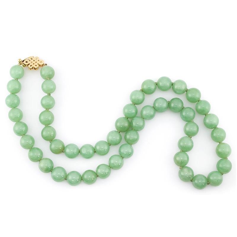 Amazing Strand!!! 48 Matching natural apple green jadeite jade beads, all approx. 13mm, comprise this gorgeous 26 inch strand with a 14K yellow gold endless knot clasp with safety. Truly beautiful!

A Mason-Kay Certificate of Authenticity will be