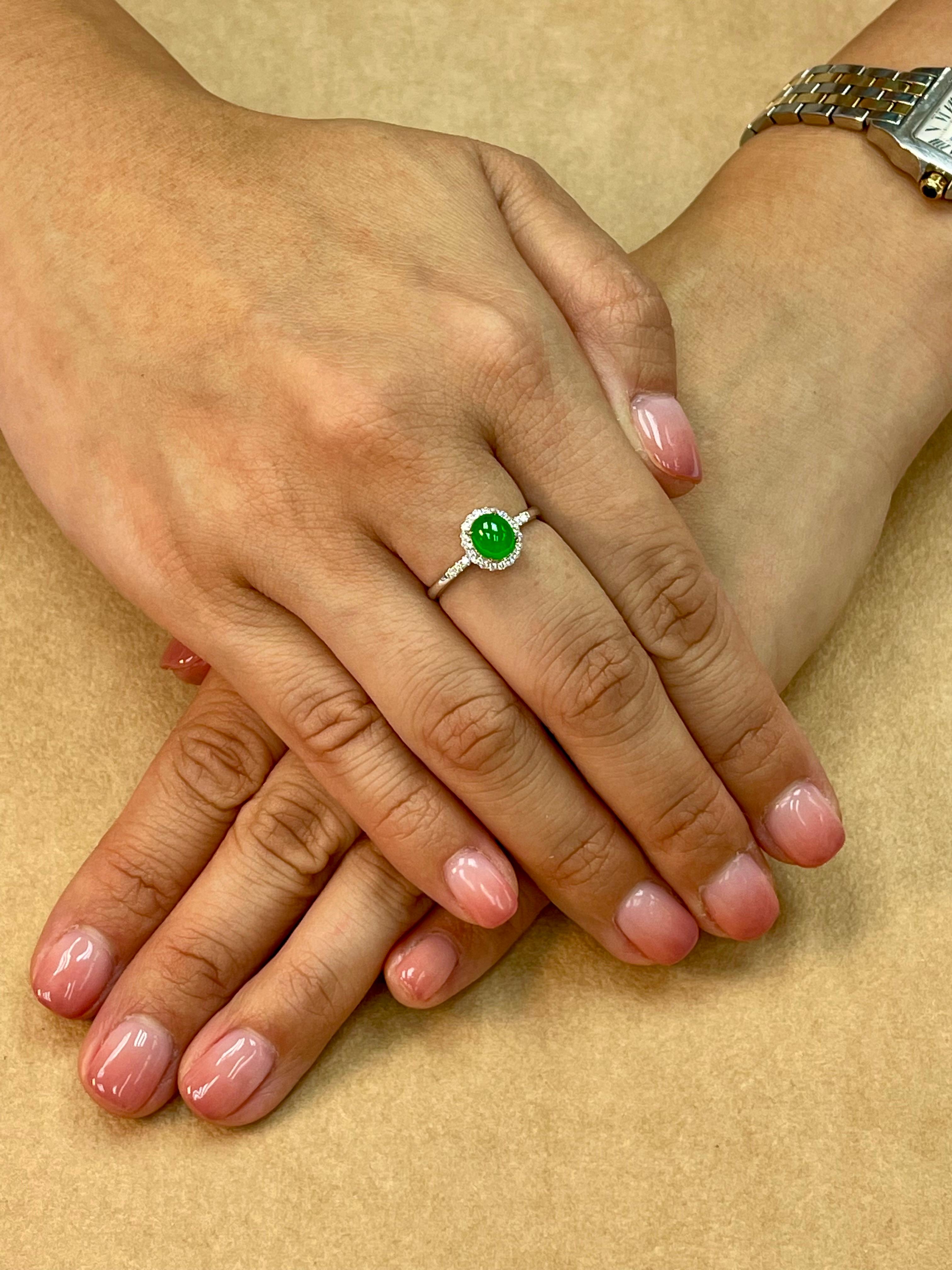 Please check out the HD video. THIS JADE GLOWS! Here is a bright apple green oval high domed cabochon jade (6.5mm) and diamond ring. This jade is one step away from being a true imperial jade! It is certified as natural jadeite jade with no