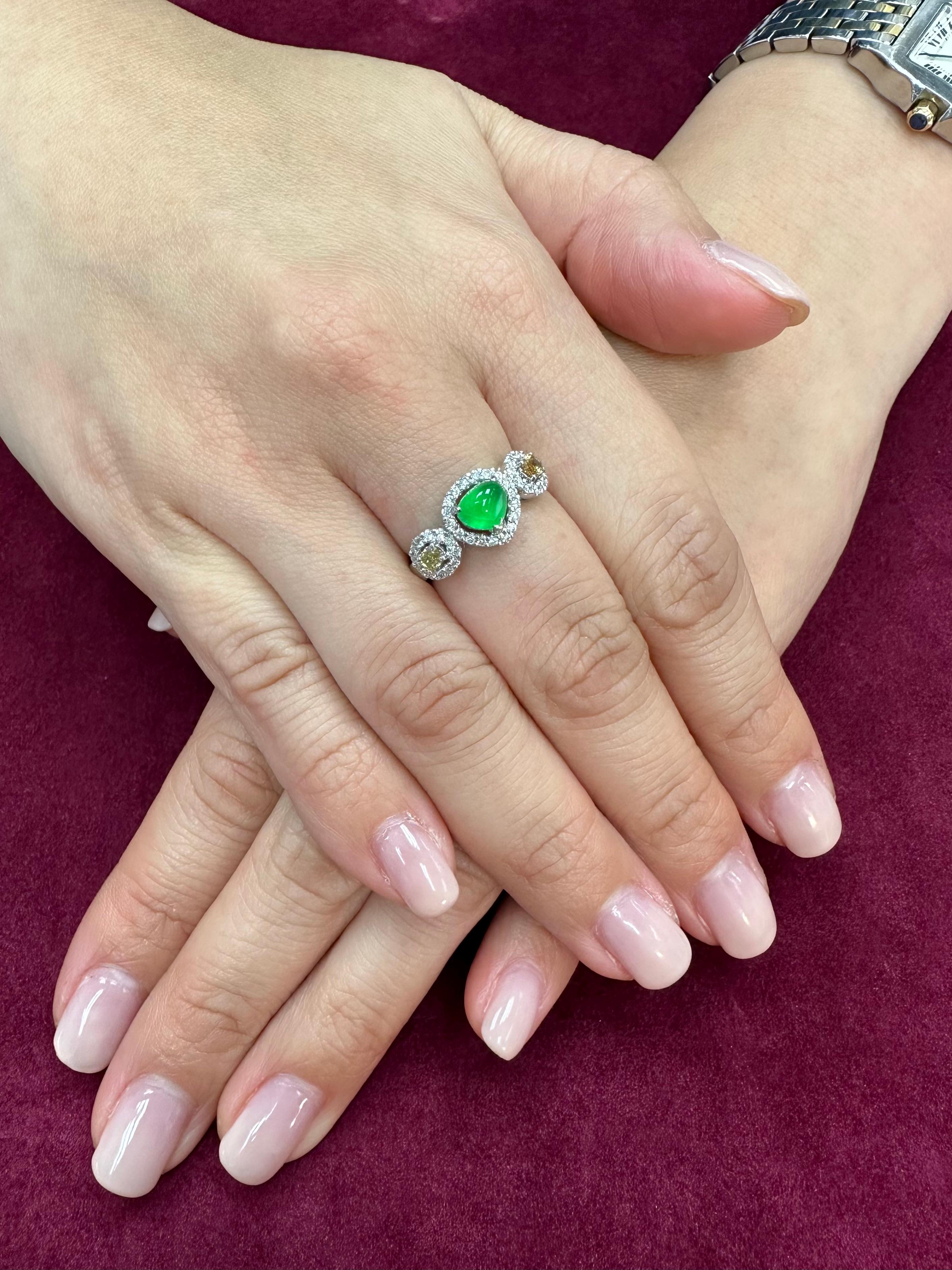 Please check out the HD video. The GLOW (under normal light) on this jade is off the charts! It is even nicer in person than any videos or photos. Here is a bright apple green Jade and fancy yellow diamond ring. It is certified. The ring is set in