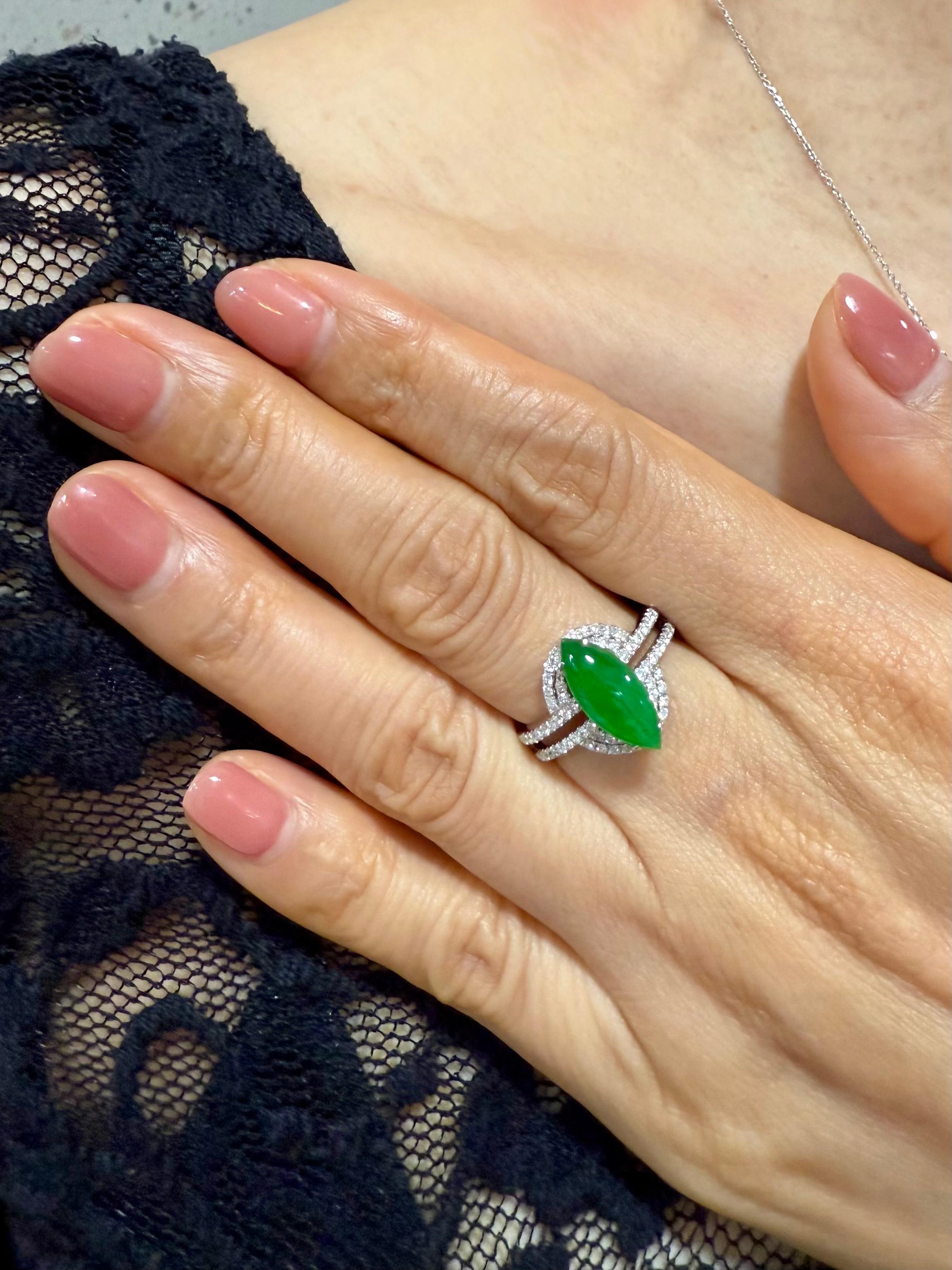 Please check out the HD video. This ring looks much nicer in person than any videos or photos. Here is a bright apple green Jade and diamond ring. It is certified. The ring is set in 18k white gold and diamonds. There are 0.34cts of white round