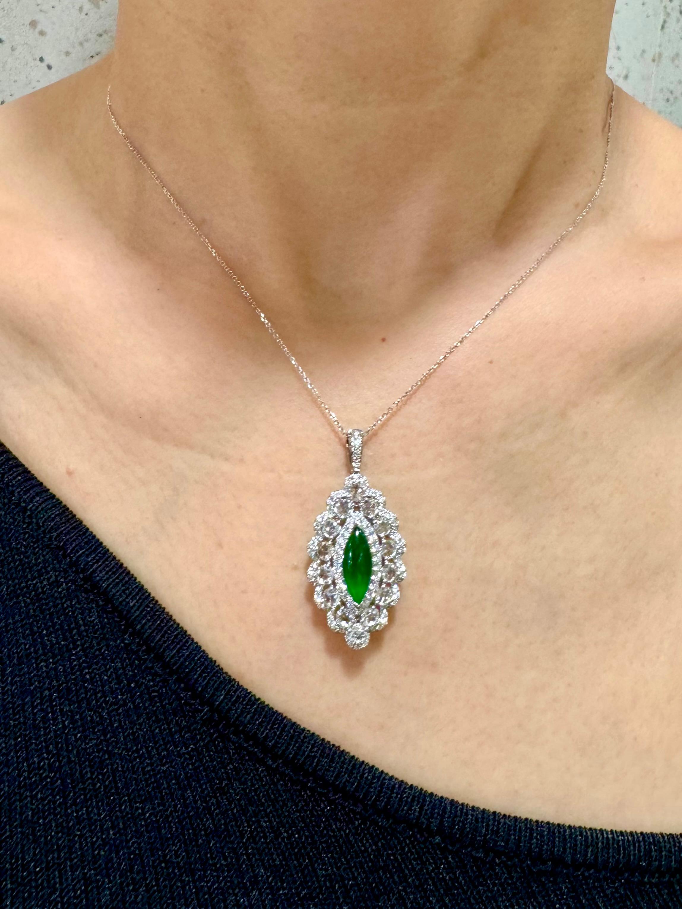 Please check out the HD video. The GLOW (under normal light) on this jade is out of this world! It's even nicer in person than any video and photos. Here is a bright imperial green Jade and diamond ring / pendant. This is a versatile piece, you can