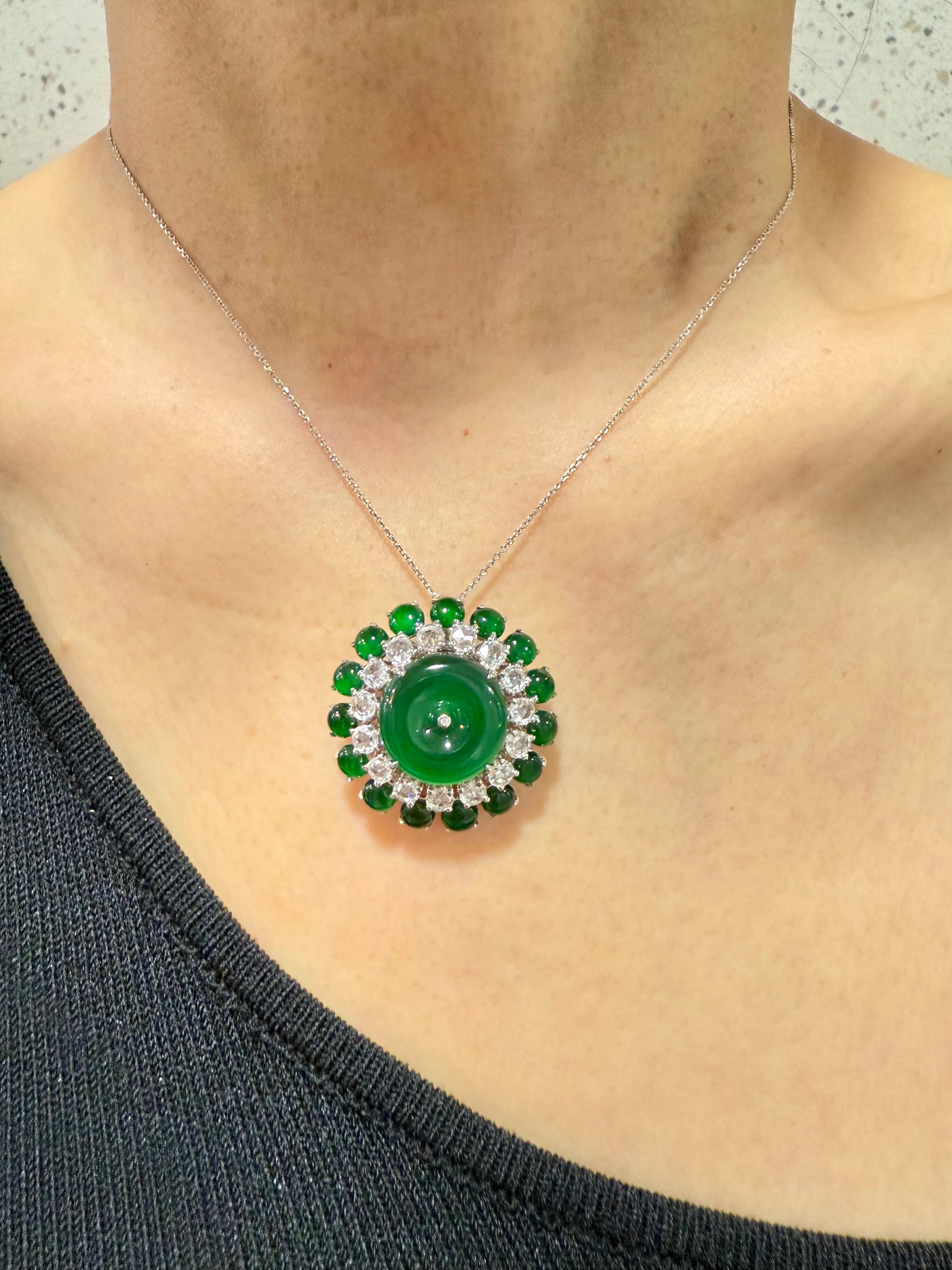 Please check out the HD video. The best of the best materials used!  The GLOW (under normal light) on this jade is out of this world! It's even nicer in person than any video and photos. Here is a bright imperial green Jade and diamond ring /