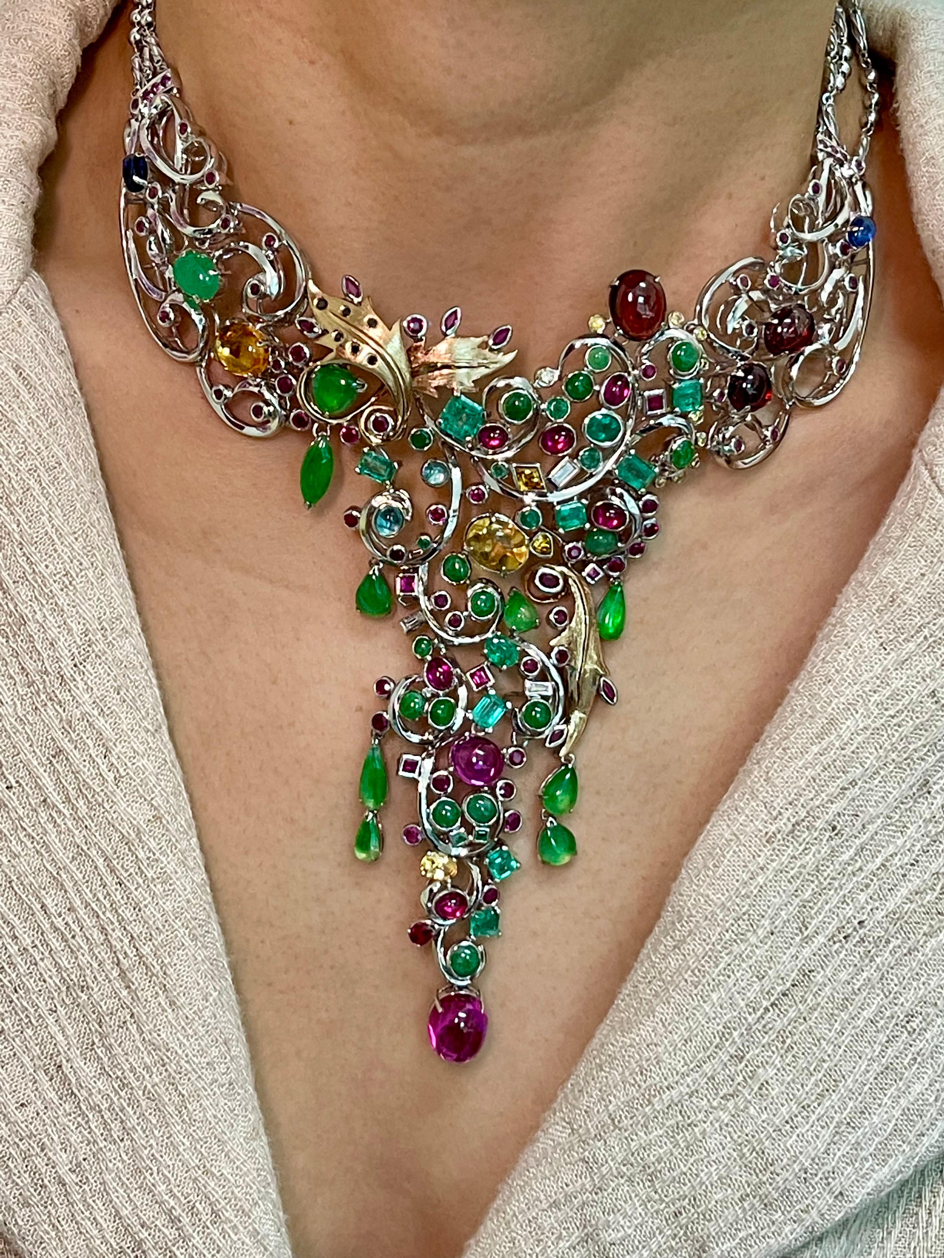 This is a massive piece of jewelry! Impressive to say the least. The workmanship is fabulous. It took many man hours to custom set all these stones. The many photos will paint a thousand words. The necklace is made in 18k gold. It is made up of many