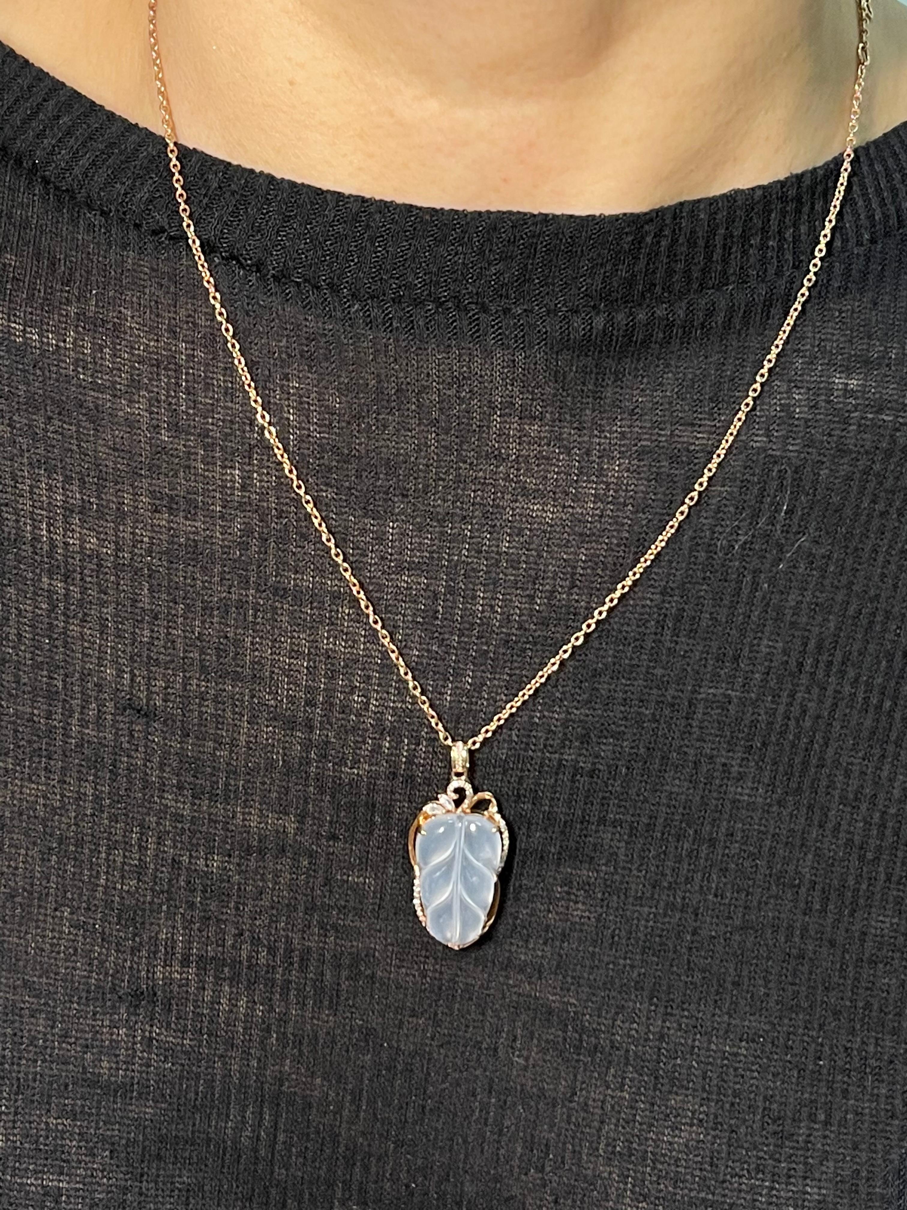 Please check out the HD video! This pendant is certified by two labs to be natural jadeite jade. The pendant is set in 18k rose gold and white diamonds. The well carved colorless icy jade leaf motif has an estimated 0.15 cts of diamonds in the