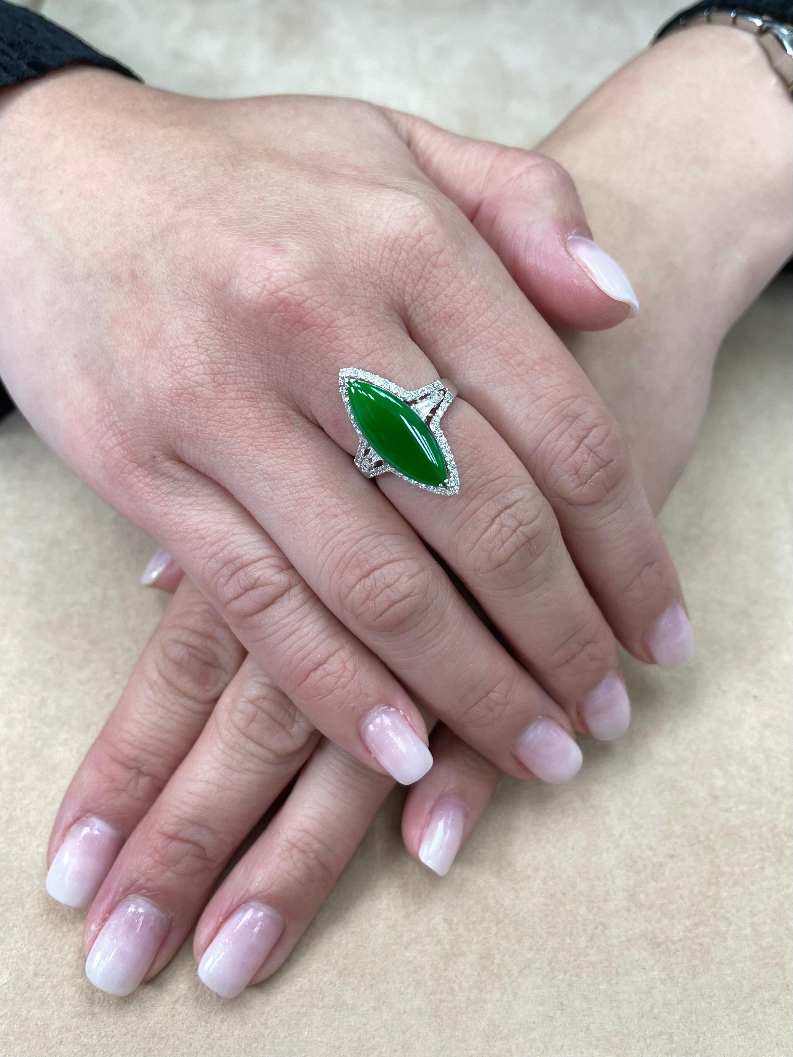 Here is an intense apple green Jade and diamond ring. It is certified. The ring is set in 18k white gold and diamonds. There are 0.508cts total of diamonds that surrounds the intense apple jade center stone. There are more diamonds on the shank of