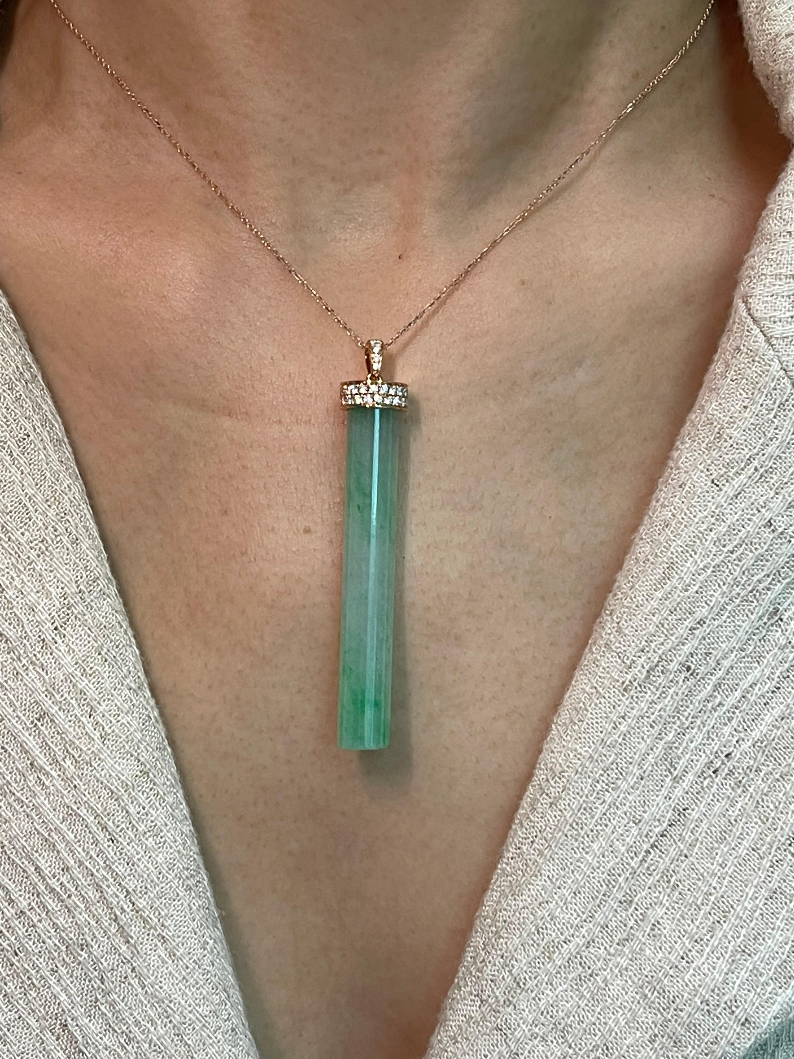 This is certified to be natural jadeite. Icy transparent jade. The pendant is set in 18k rose gold and diamonds. There are a total of 0.42 cts of diamonds in this setting. In jadeite jade 2 main features determines the price 1) the saturation of