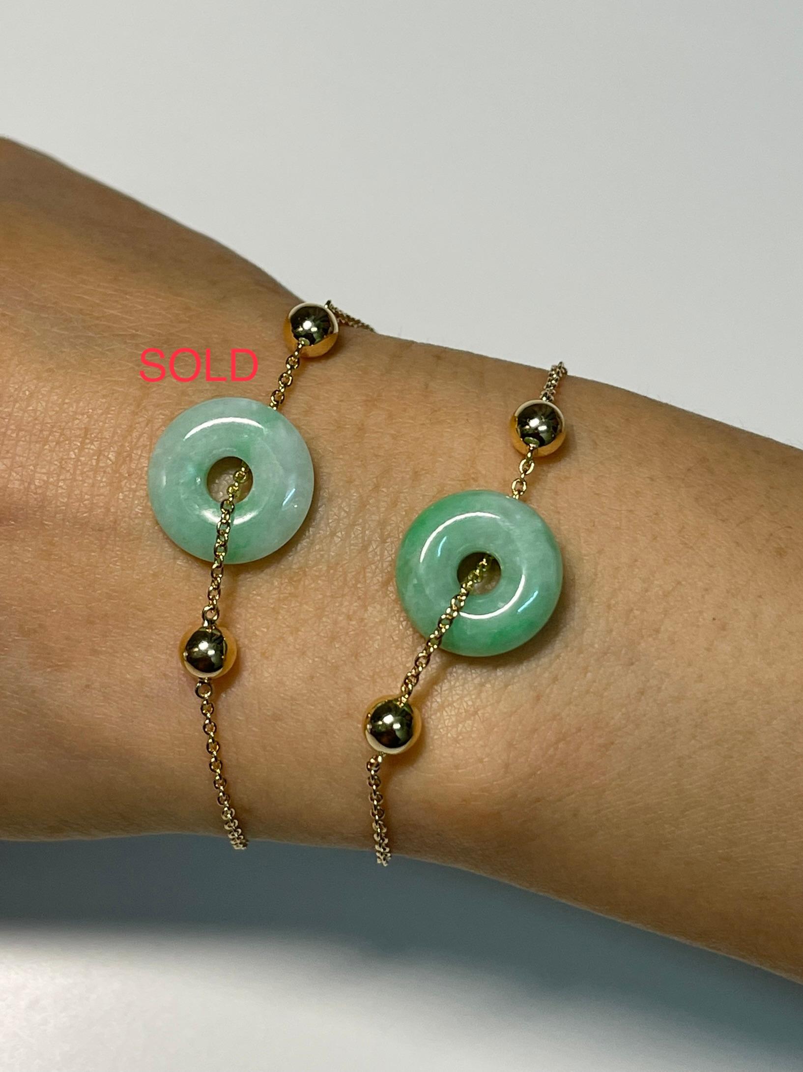 Please check out the HD video. This is certified natural jadeite jade. The bracelet is set in yellow gold. The jade donut has light green all over with patches of apple green. The untreated / un-enhanced natural jade in this bracelet is very eye